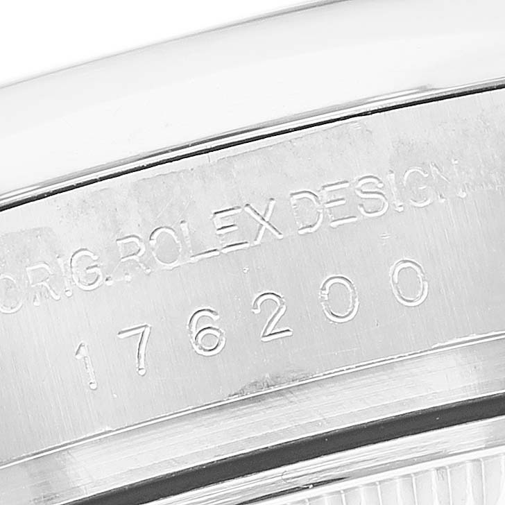 The image shows a close-up of the case back engraving on a Rolex Oyster Perpetual 176200 Women's Stainless Steel Purple Dial watch, displaying the design number.