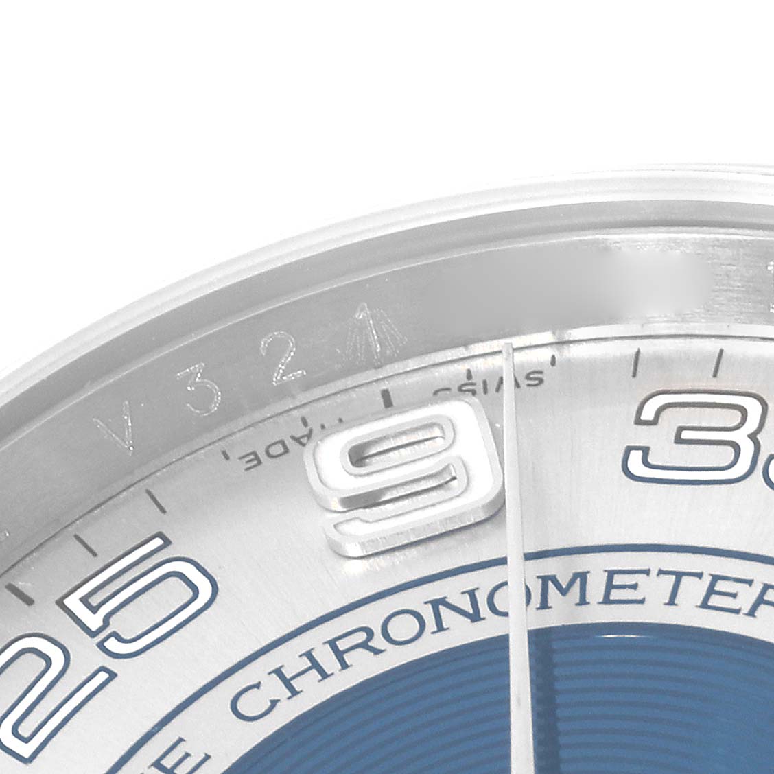 This image shows a close-up of the dial and bezel area at an angle, highlighting the "9" and partial "25" markers on the Rolex Oyster Perpetual 116000 Men's Stainless Steel Silver Dial 116000 Men's Stainless Steel Silver Dial watch.