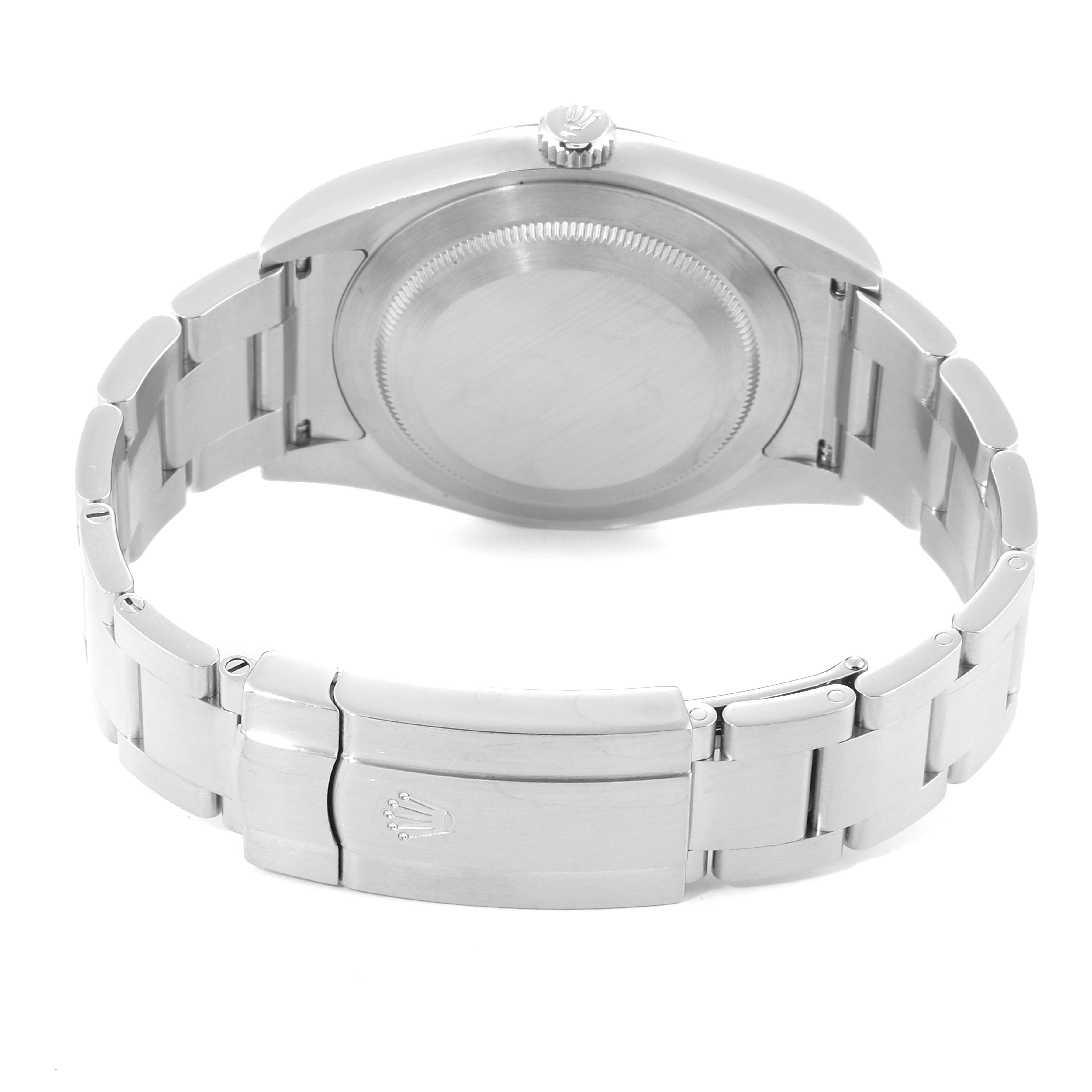 The image shows the backside and bracelet of a Rolex Oyster Perpetual 114300 Men's Stainless Steel Blue Dial 114300 Men's Stainless Steel Blue Dial watch.