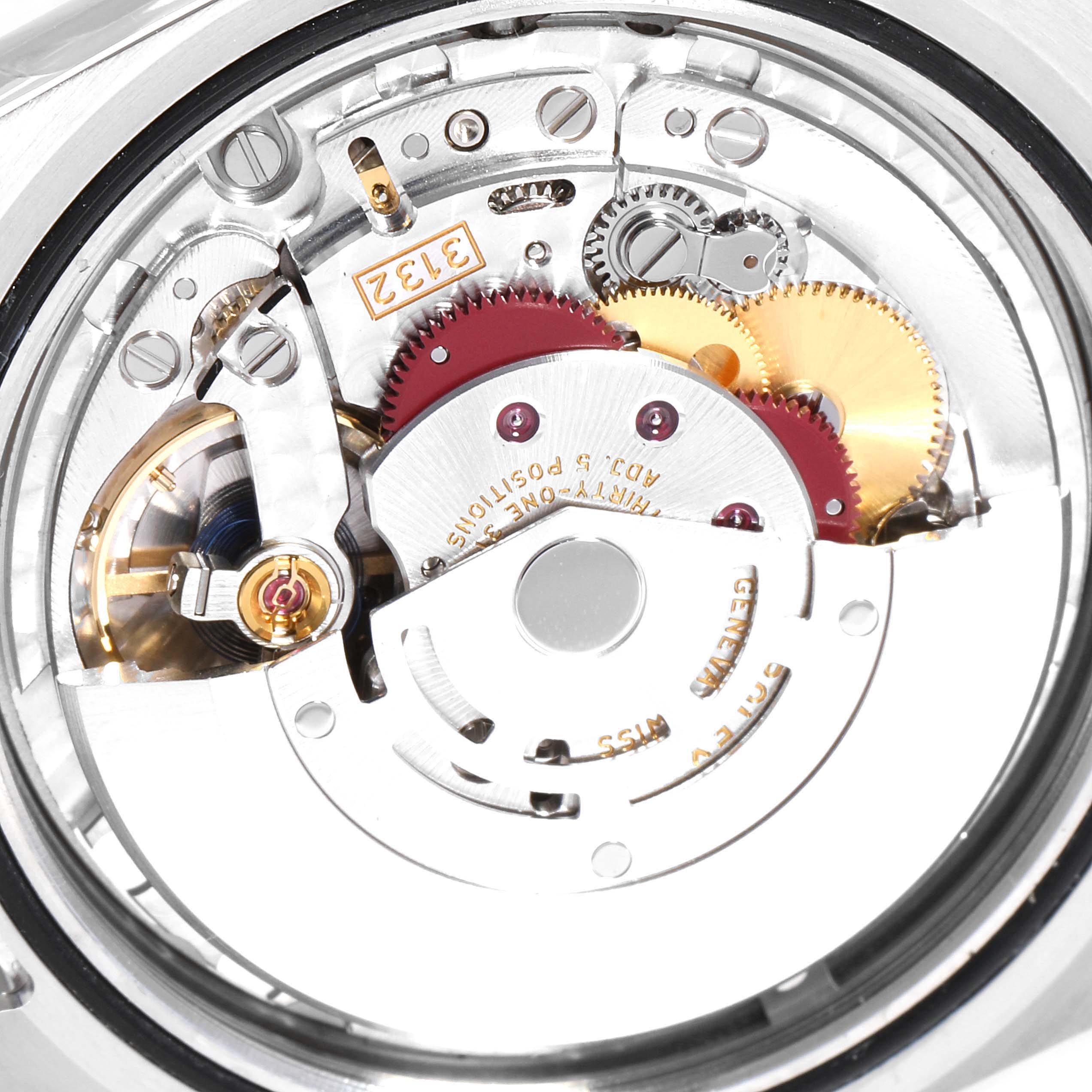 This image shows a detailed view of the internal mechanism of a Rolex Oyster Perpetual 114300 Men's Stainless Steel Blue Dial 114300 Men's Stainless Steel Blue Dial watch, highlighting its gears and components.