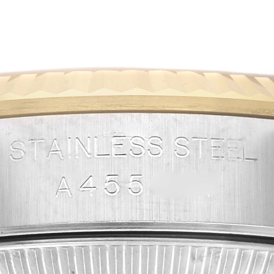 The image shows a close-up of the side case and engravings of a Rolex Oyster Perpetual 76193 Women's Steel and Gold (two tone) Black Dial 76193 Women's Steel and Gold (two tone) Black Dial watch, highlighting the text "STAINLESS STEEL A455."