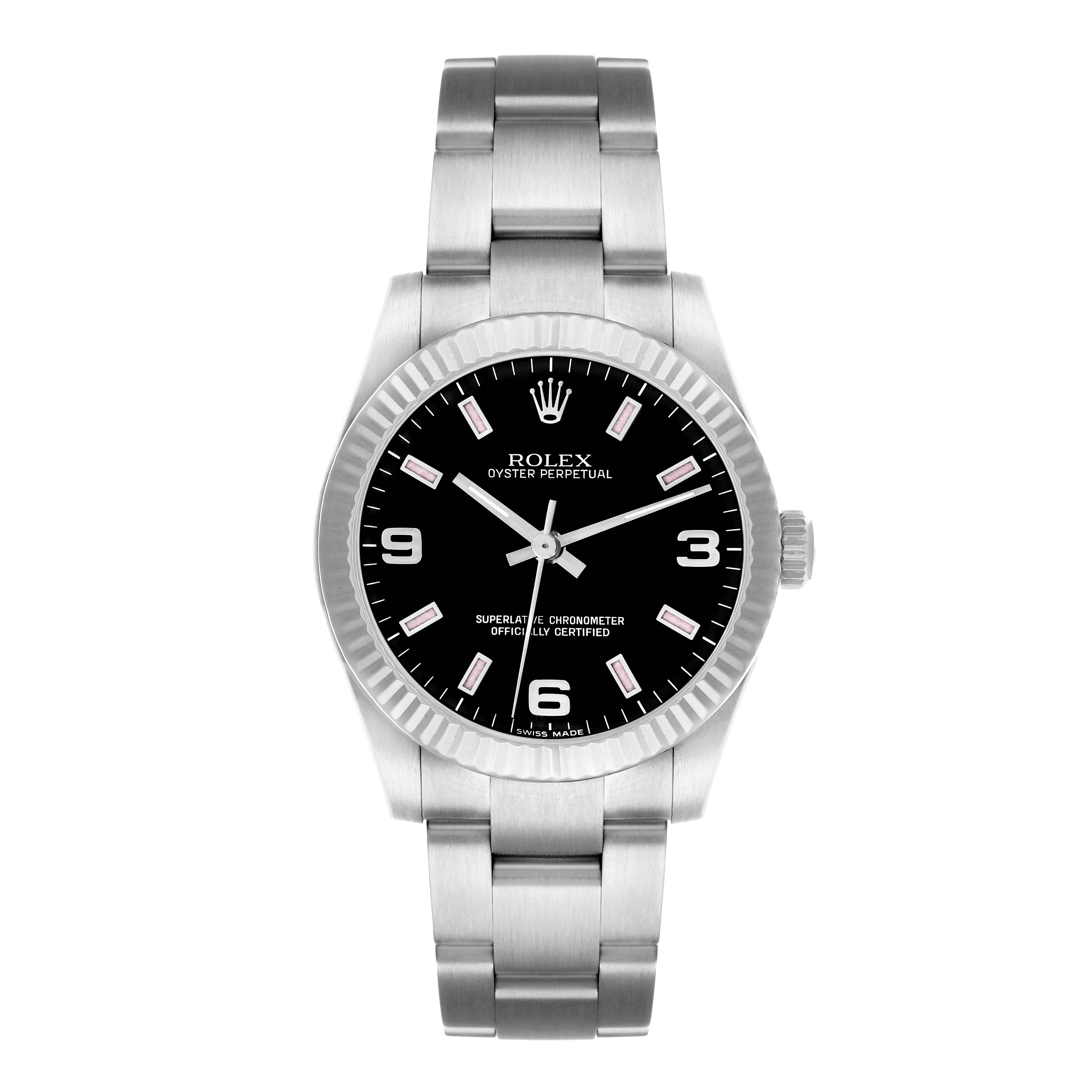 The Rolex Oyster Perpetual Mid-Size watch is shown from a top-down angle, displaying the face, bezel, crown, and bracelet.