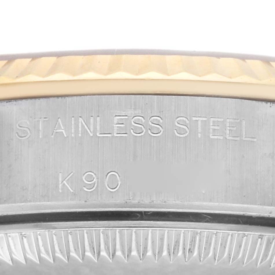 This image shows a close-up of the case back of a Rolex Oyster Perpetual 76193 Women's Steel and Gold (two tone) Champagne Dial 76193 Women's Steel and Gold (two tone) Champagne Dial watch, highlighting the stainless steel engraving.