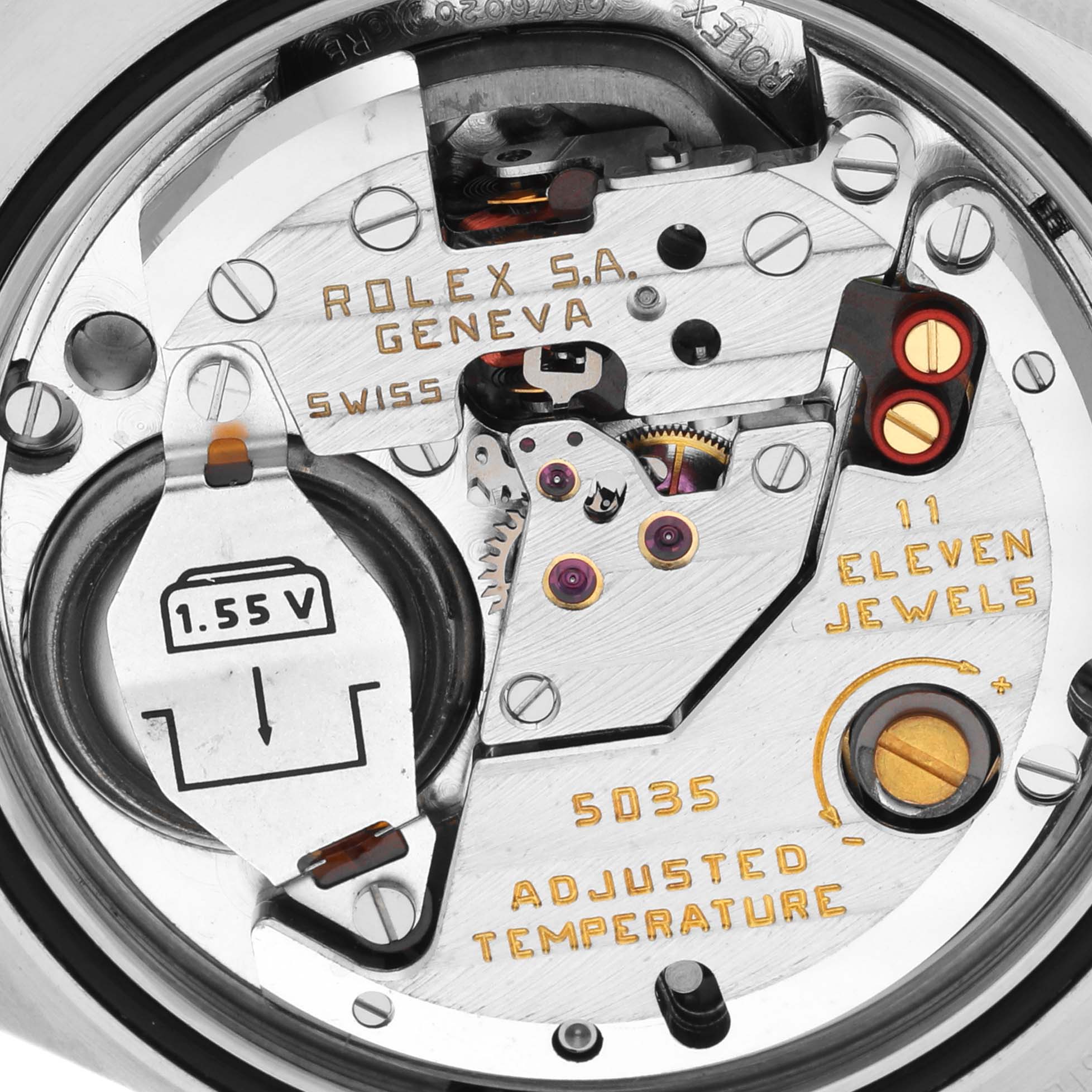 Close-up of the Rolex Oysterquartz 17013 Men
s Steel and Gold (two tone) Black Dial 17013 Men
s Steel and Gold (two tone) Black Dial movement showing the inner mechanisms and engraved markings.