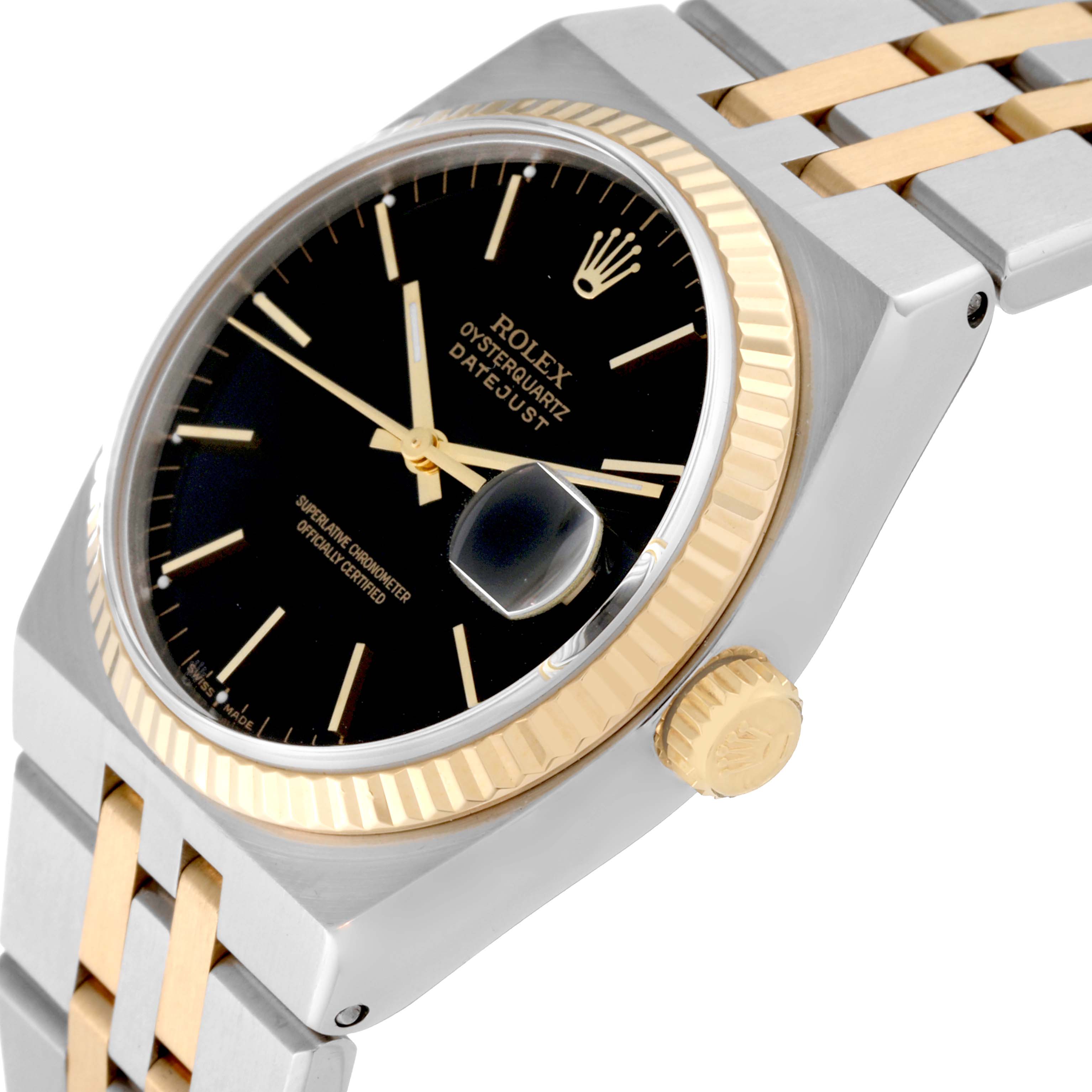 The Rolex Oysterquartz 17013 Men
s Steel and Gold (two tone) Black Dial 17013 Men
s Steel and Gold (two tone) Black Dial watch is shown at an angled close-up, displaying the dial, fluted bezel, crown, and part of the bracelet.
