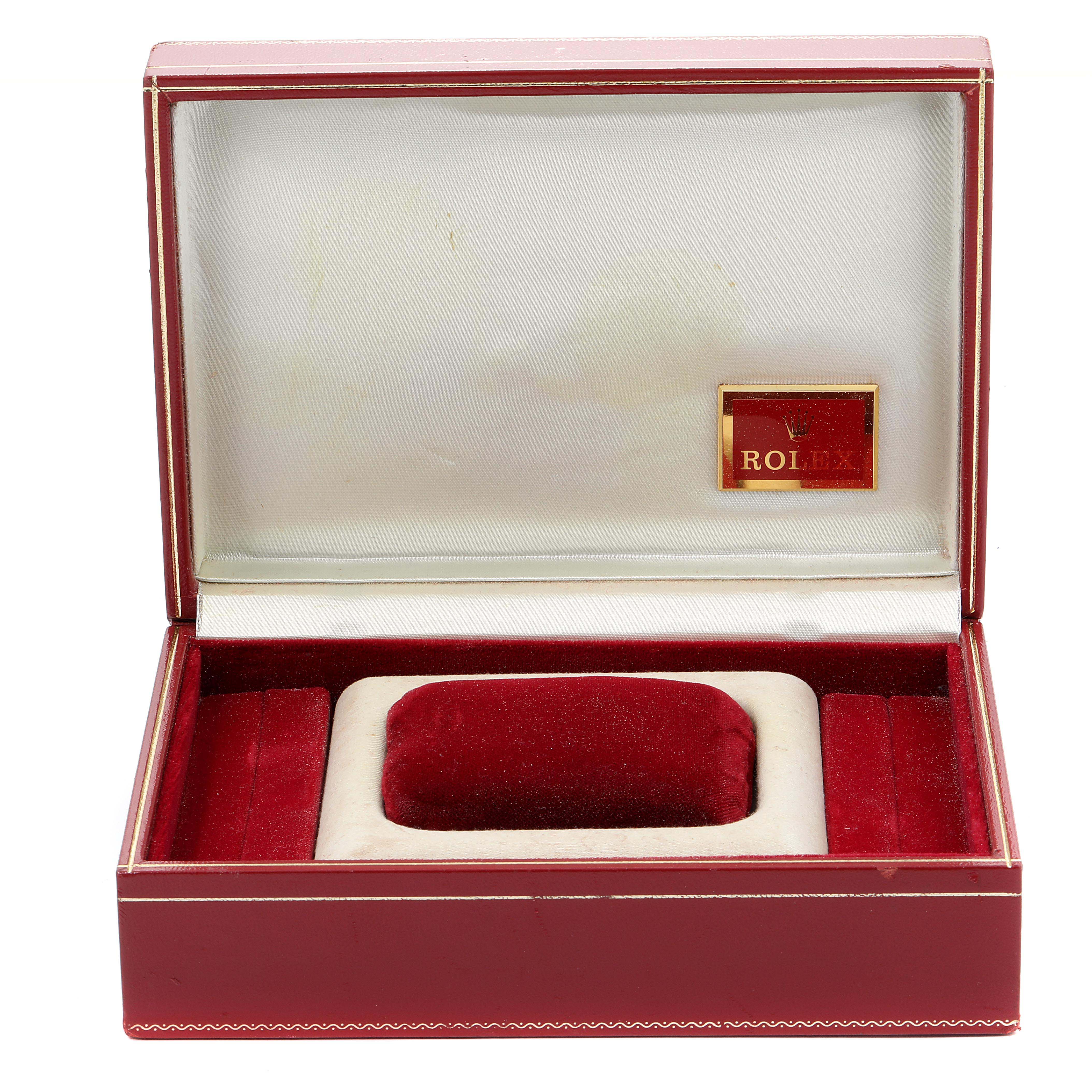 An empty red and white Rolex President 69179 Women
s White Gold Silver Dial 69179 Women
s White Gold Silver Dial watch box is shown, open and viewed from the front.