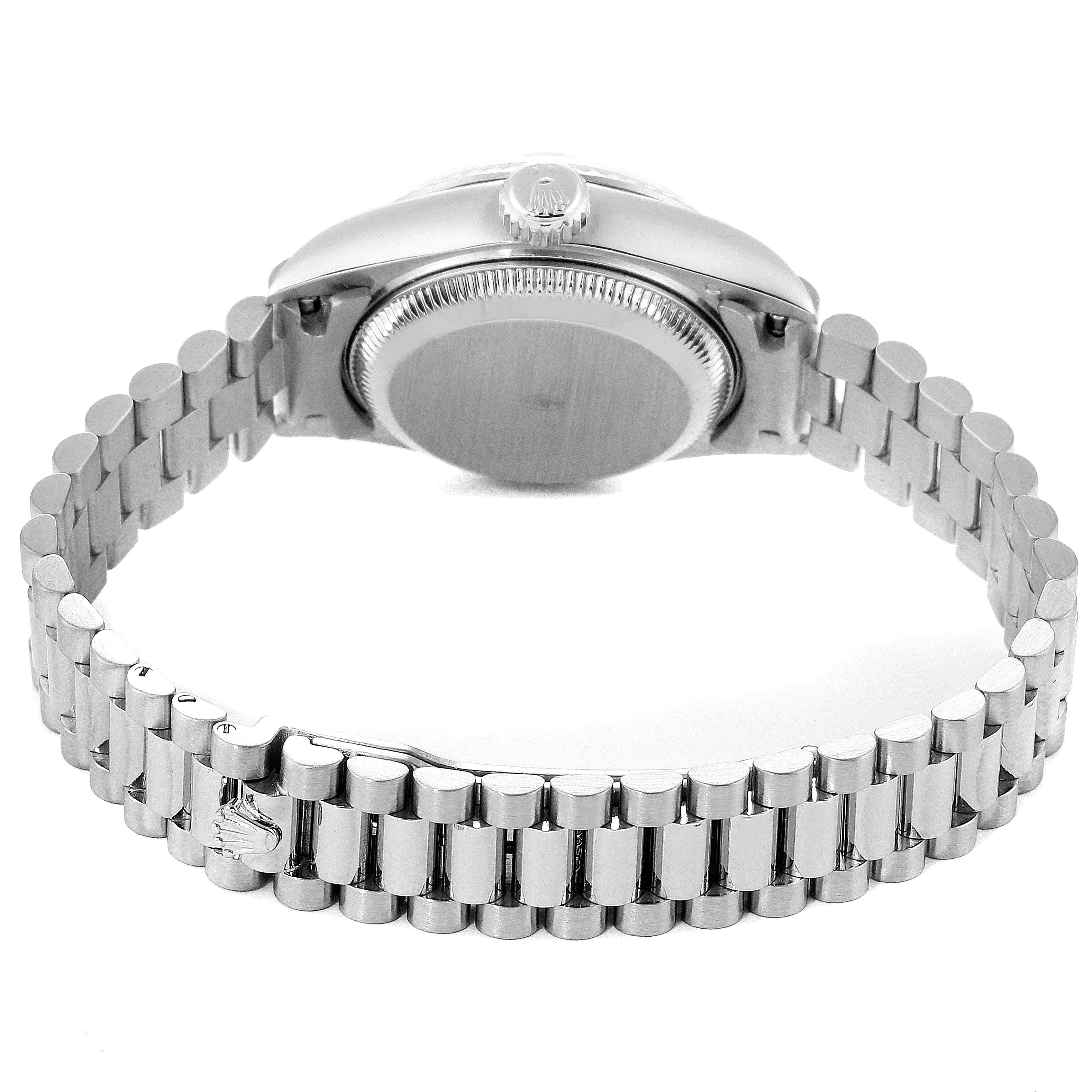 The image shows the back case and wristband of a Rolex President 69179 Women
s White Gold Silver Dial 69179 Women
s White Gold Silver Dial model watch, viewed from the side and rear.