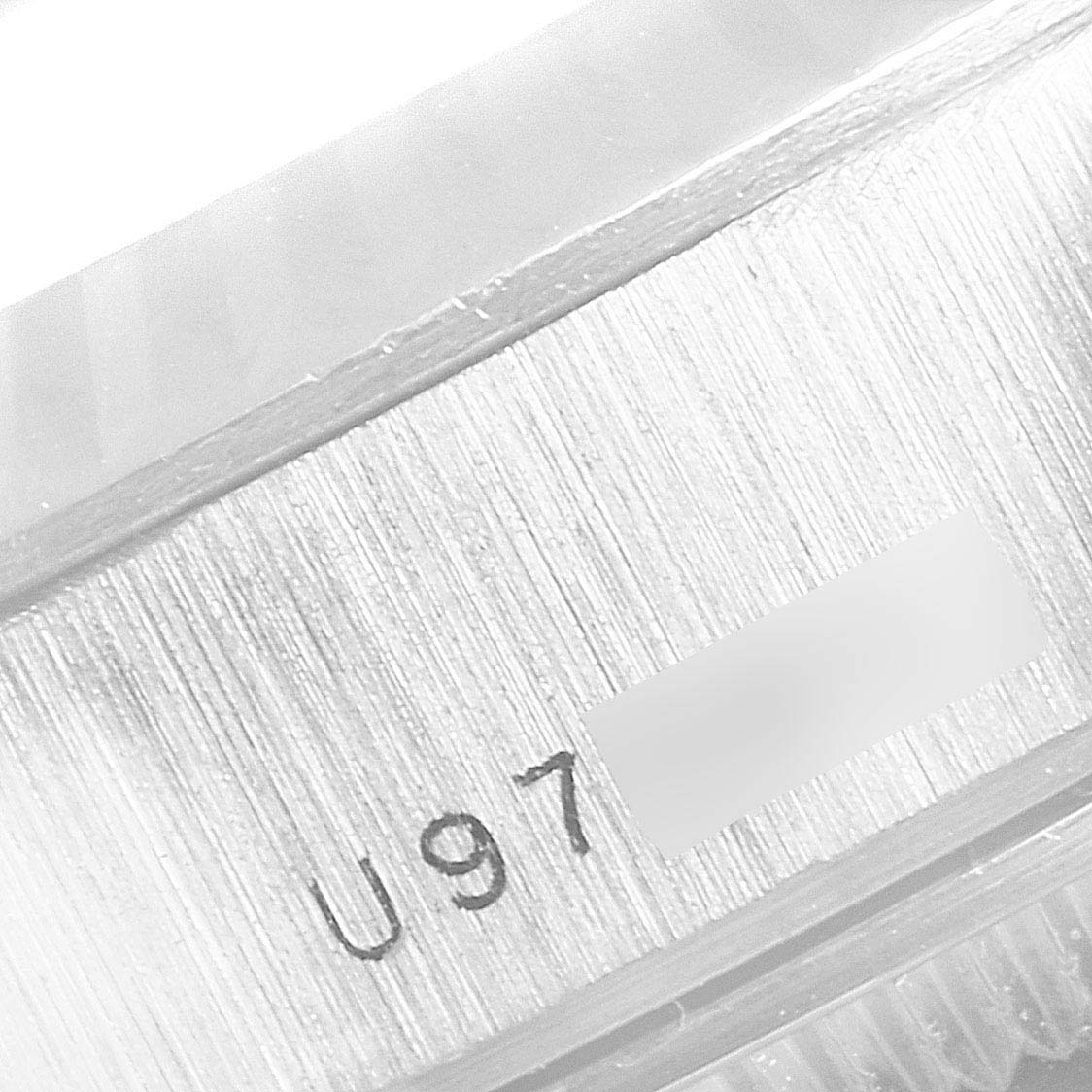 This image shows a close-up of the serial number engraving on the case of a Rolex President 69179 Women
s White Gold Silver Dial 69179 Women
s White Gold Silver Dial model watch.