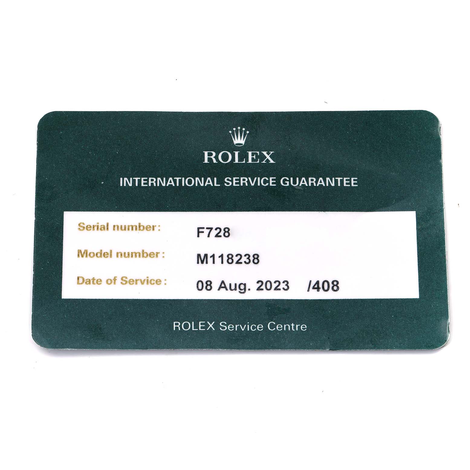 The image shows a Rolex service guarantee card for the President model M118238.