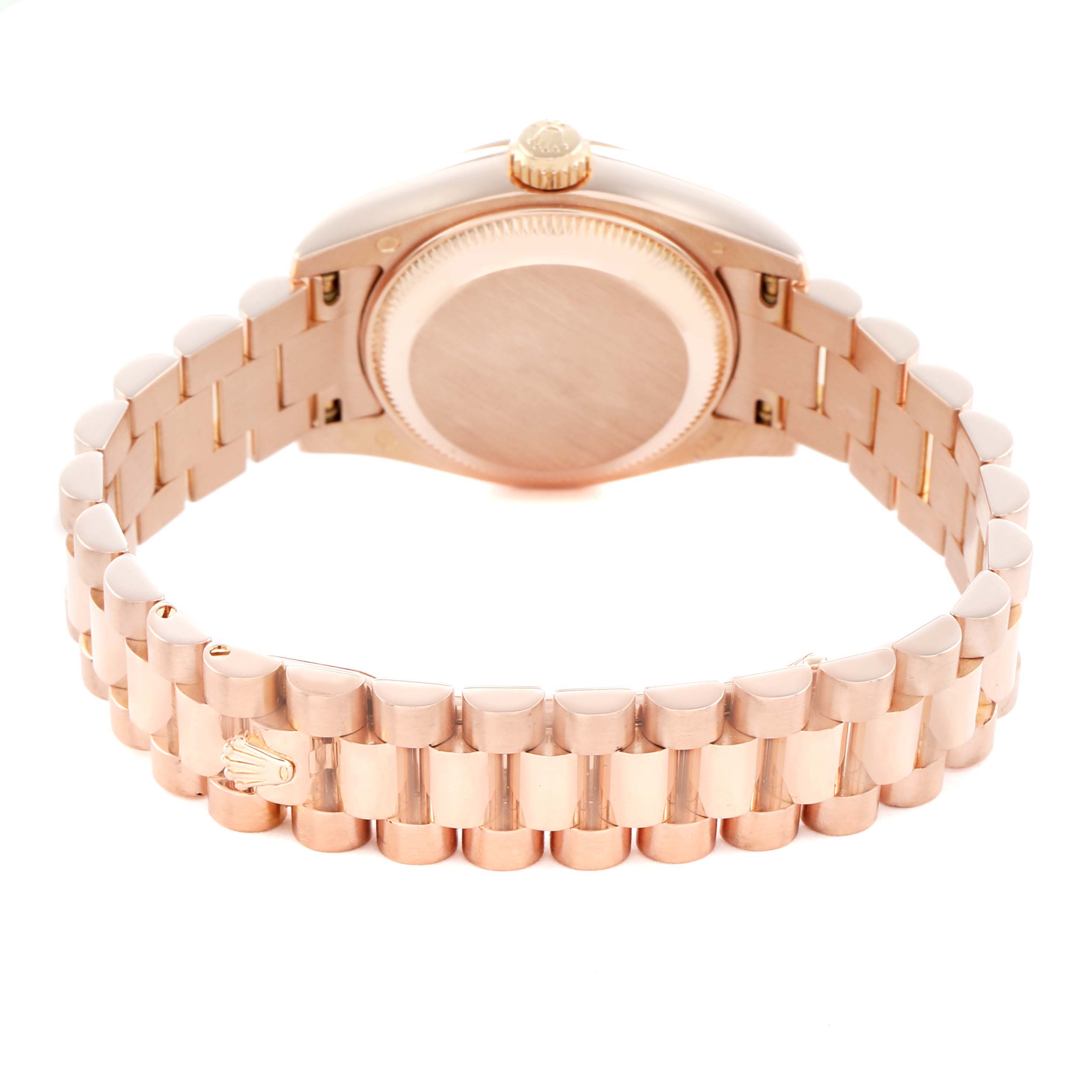 The Rolex President 179175 Women
s Rose Gold Pink Dial model is shown from the back, highlighting its bracelet, case back, and crown.
