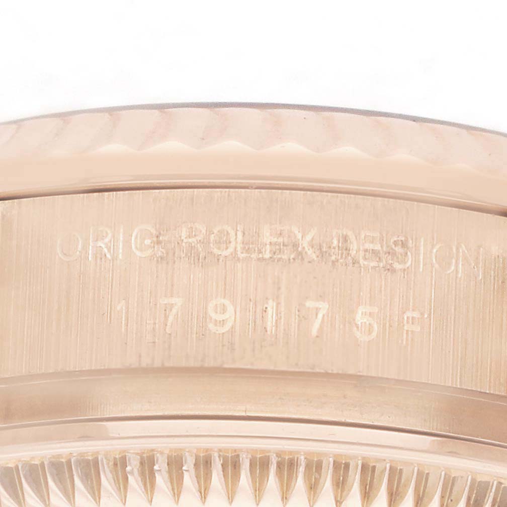 The image shows a close-up of the side of a Rolex President 179175 Women
s Rose Gold Pink Dial model, highlighting the engraved design number.