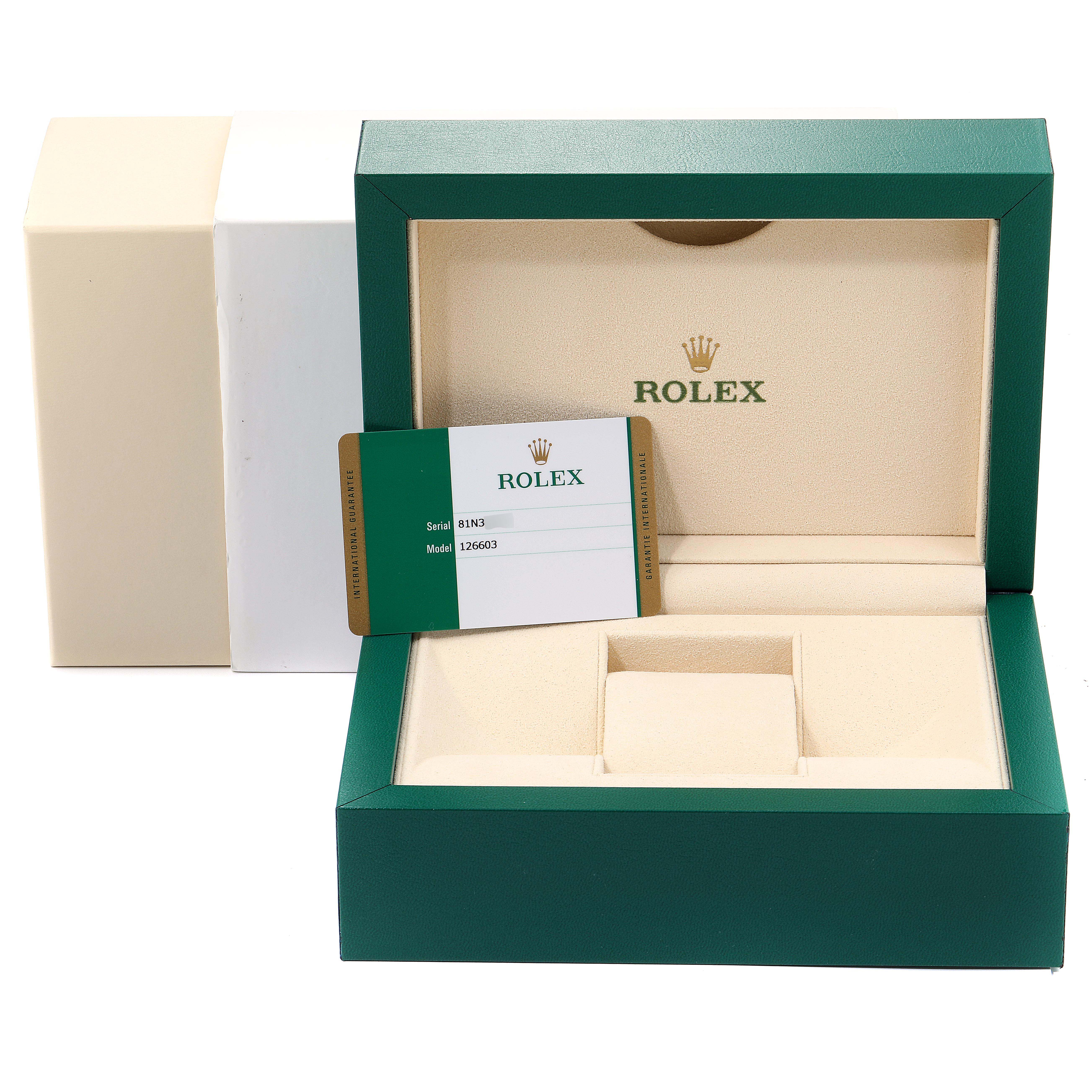 The image shows the open box and warranty card for a Rolex Sea-Dweller 126603 Men
s Steel and Gold (two tone) Black Dial 126603 Men
s Steel and Gold (two tone) Black Dial watch.