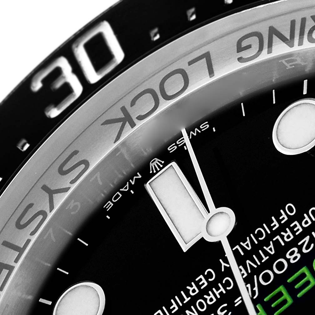 The image shows a close-up of the bezel and partial dial of a Rolex Sea-Dweller 136660 Men
s Stainless Steel Blue Dial, focusing on the "RING LOCK SYSTEM" text and hour markers.