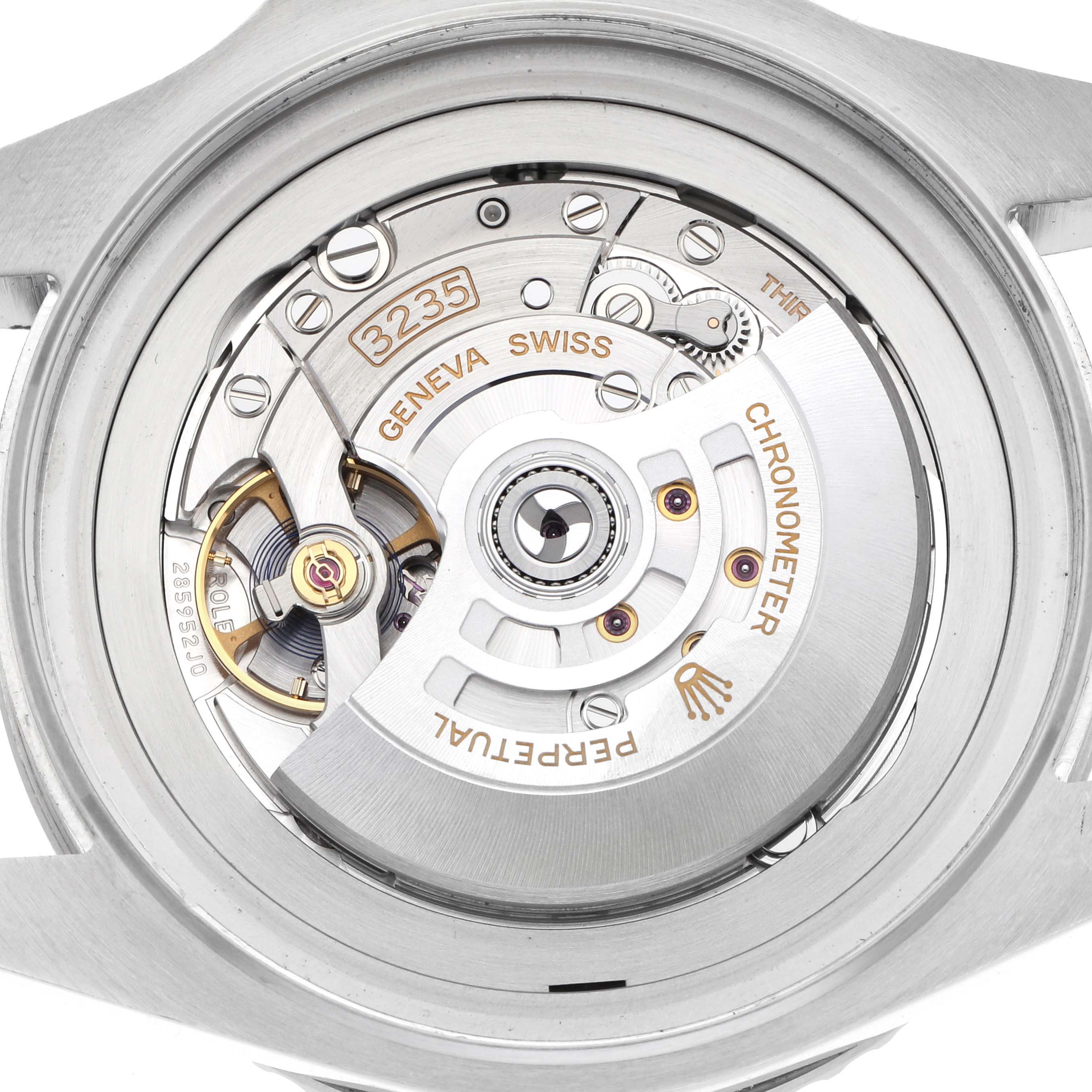 The image shows the movement from the back of a Rolex Sea-Dweller 136660 Men
s Stainless Steel Blue Dial, highlighting the intricate mechanics.