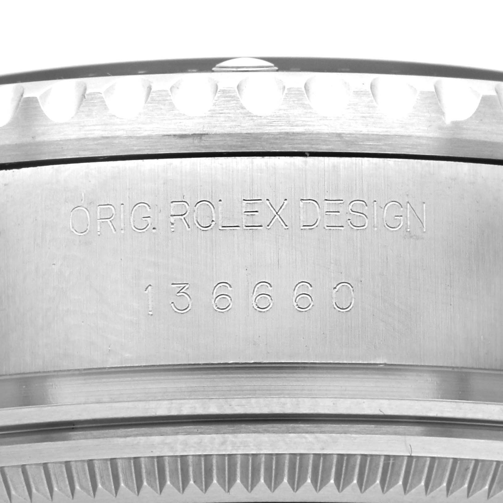 The image shows a close-up of the side of a Rolex Sea-Dweller 136660 Men
s Stainless Steel Blue Dial case, highlighting the engraved model number "136660" and "ORIG. ROLEX DESIGN."