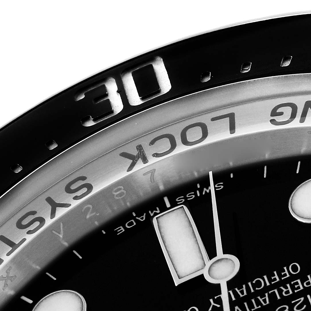 The image shows a close-up of the bezel and part of the dial of a Rolex Sea-Dweller 116660 Men
s Stainless Steel Black Dial 116660 Men
s Stainless Steel Black Dial watch, focusing on the "30" minute marker.