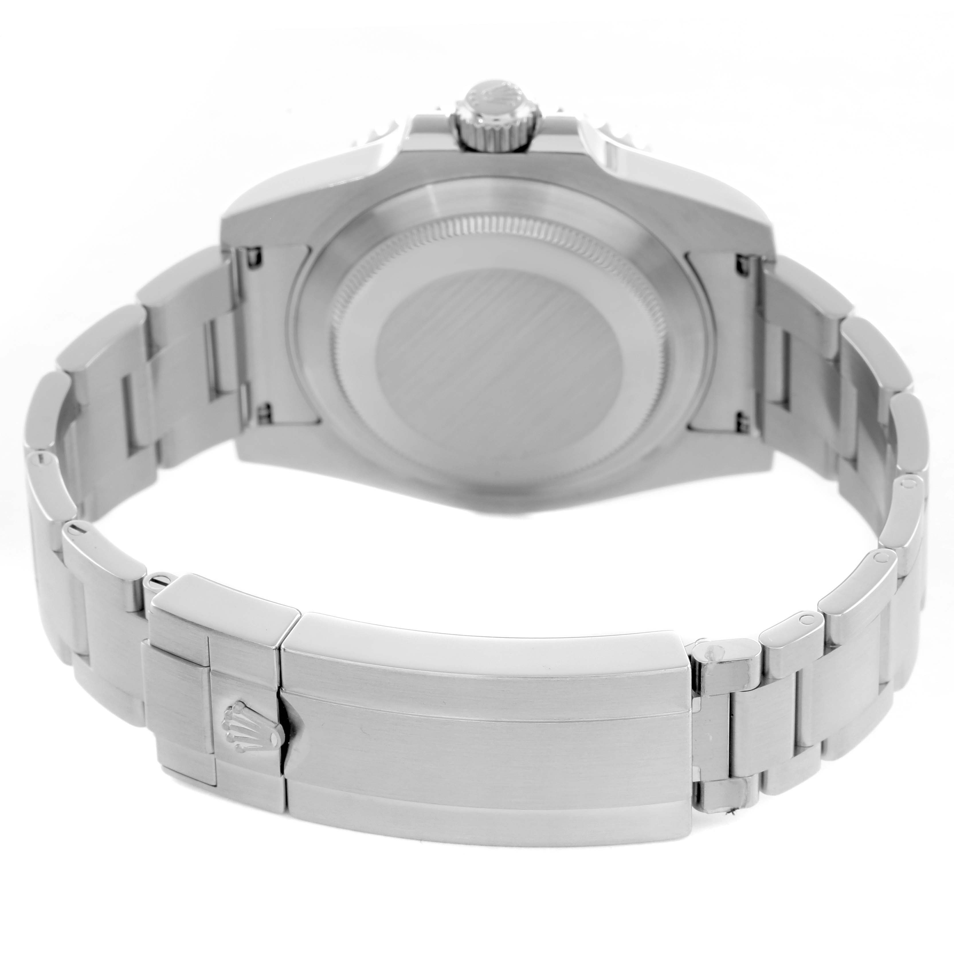 The image shows a Rolex Submariner 116610 Men
s Stainless Steel Green Dial watch from the back, highlighting the case back, bracelet, clasp, and crown.