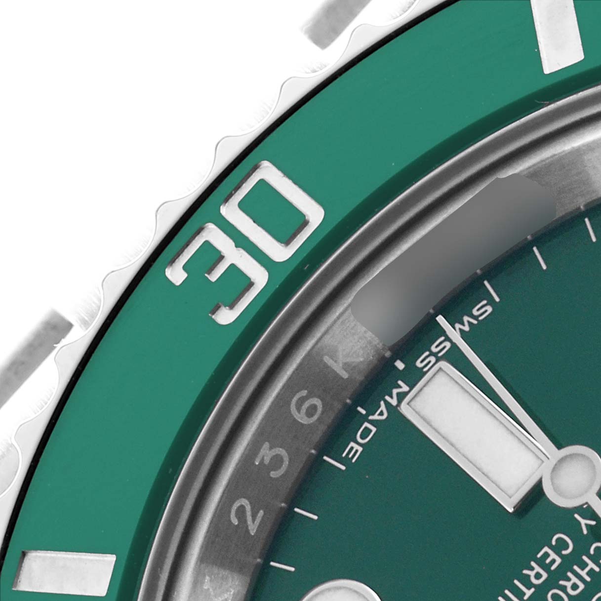The image shows a close-up of the bezel and dial of a Rolex Submariner 116610 Men
s Stainless Steel Green Dial, highlighting the "30" marker and part of the watch face.