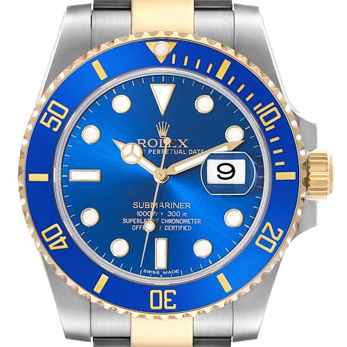 The image shows a front view of a Rolex Submariner watch with a blue dial and bezel, gold accents, and a date display.