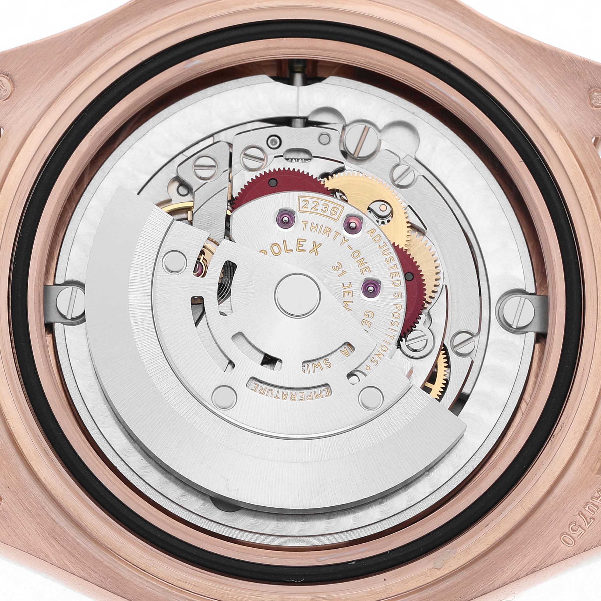 This image shows the movement of a Rolex Yacht-Master 268655 Men's Rose Gold Black Dial, viewed from the back displaying gears and the rotor.