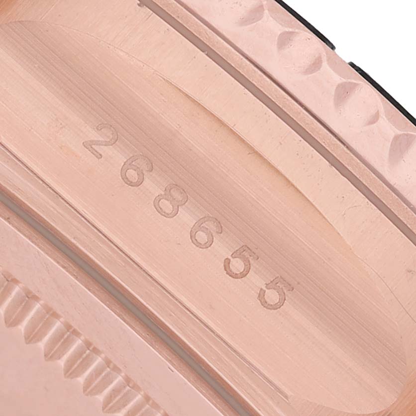 The image shows a close-up of the Rolex Yacht-Master 268655 Men's Rose Gold Black Dial's case side, displaying the serial number engraving.