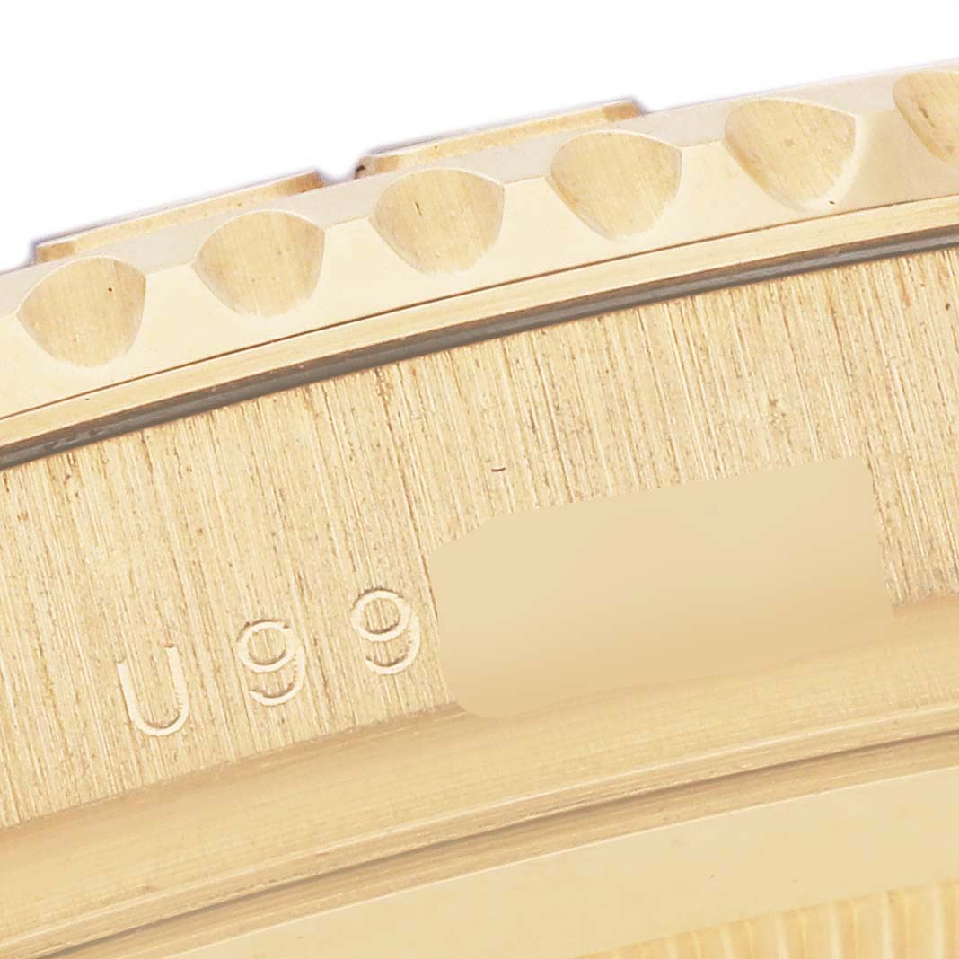 This close-up image shows the side view of the bezel and case serial number of a Rolex Yacht-Master 16628 Men's Yellow Gold Blue Dial 16628 Men's Yellow Gold Blue Dial watch.