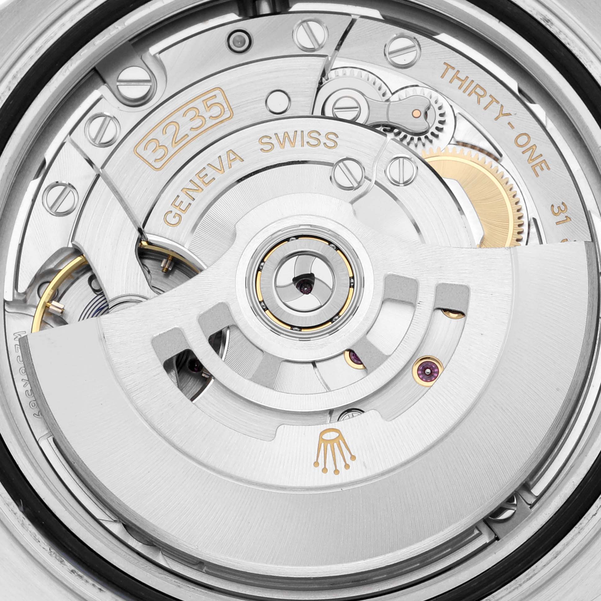 This image shows the intricate internal mechanism of a Rolex Yacht-Master 126621 Men's Steel and Gold (two tone) Brown Dial 126621 Men's Steel and Gold (two tone) Brown Dial watch from a close-up angle.