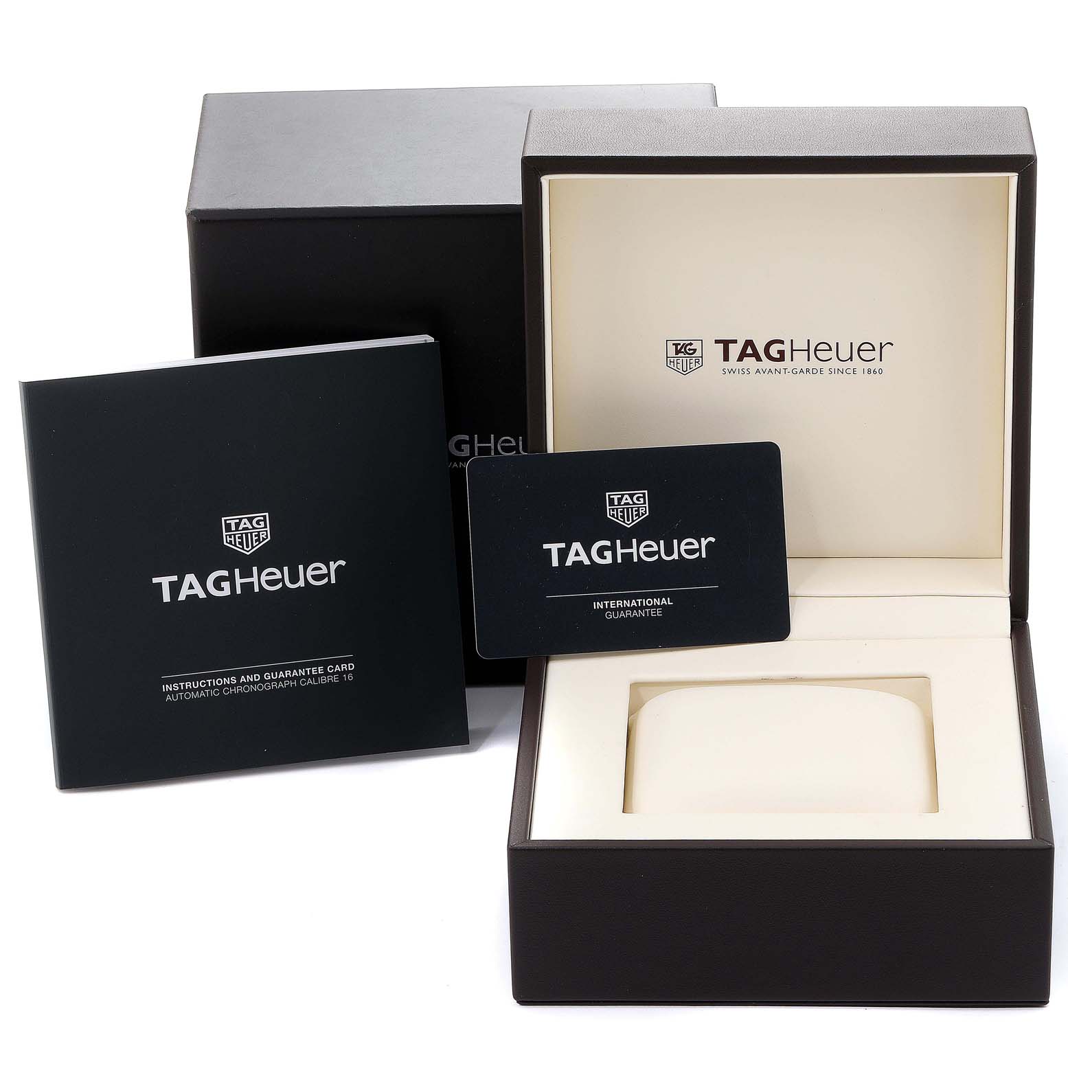 The image shows the packaging and manuals for the Carrera model by Tag Heuer, including the watch box and guarantee card.
