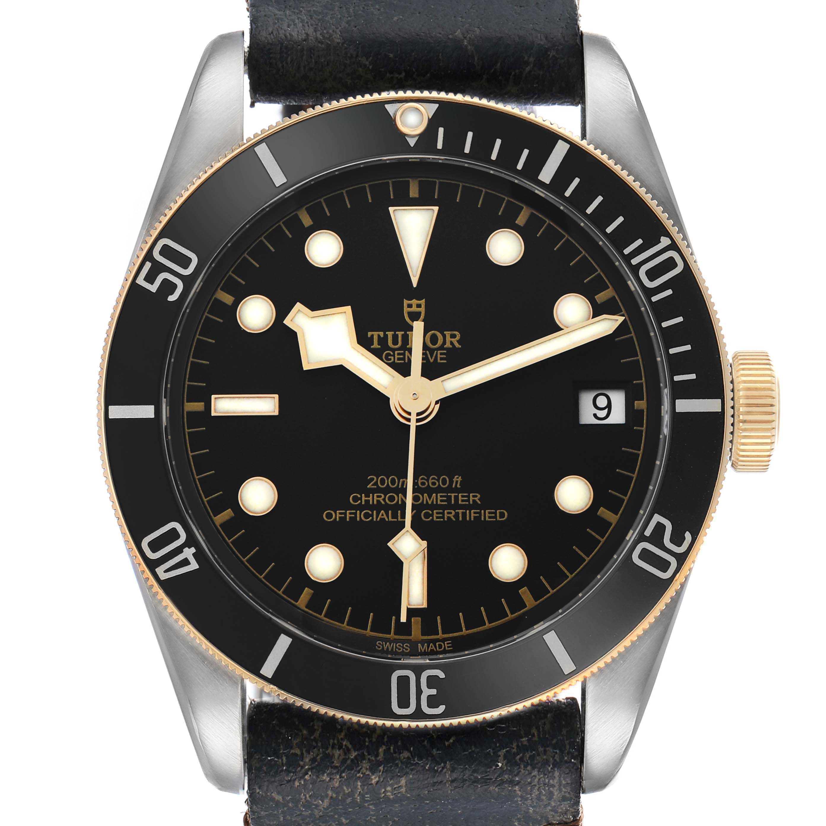 The Tudor Heritage Black Bay 79733 Men
s Steel and Gold (two tone) Black Dial watch is shown from a front-facing angle, highlighting the dial, bezel, and crown.