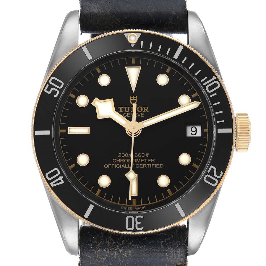 The Tudor Heritage Black Bay 79733 Men's Steel and Gold (two tone) Black Dial watch is shown from a front-facing angle, highlighting the dial, bezel, and crown.
