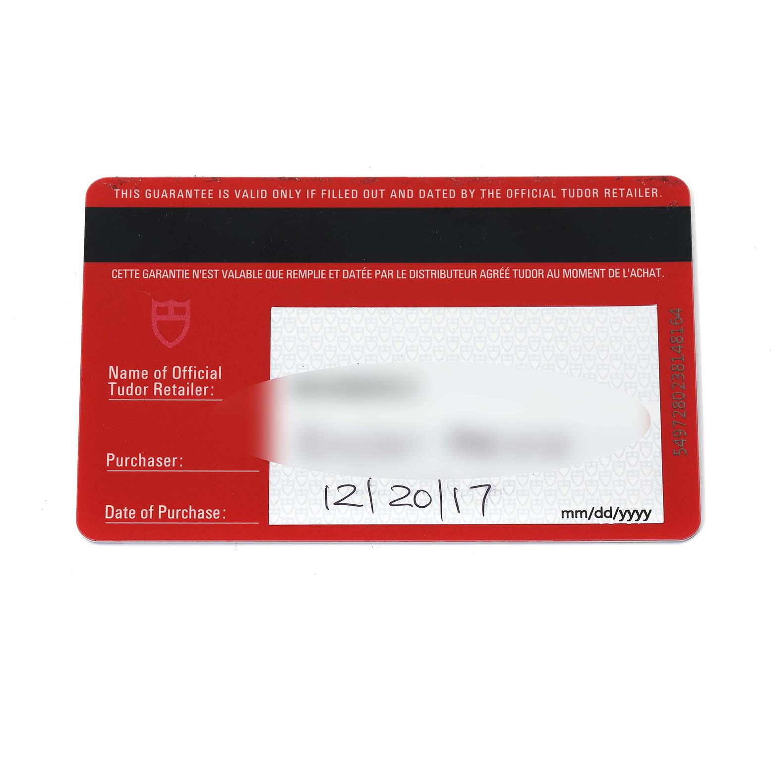 The image shows a Tudor Heritage Black Bay 79733 Men
s Steel and Gold (two tone) Black Dial warranty card displaying purchase information.