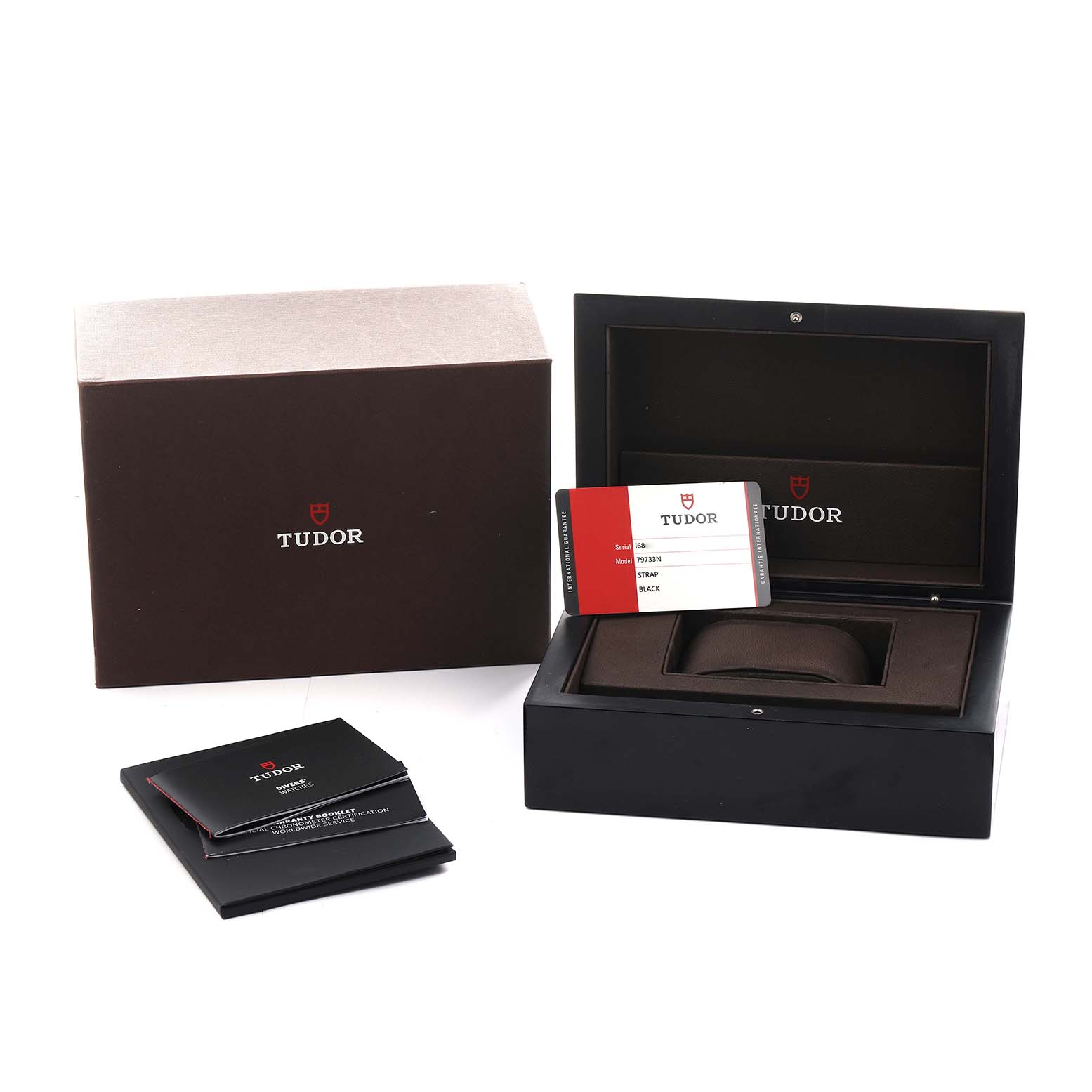 The image shows the Tudor Heritage Black Bay 79733 Men
s Steel and Gold (two tone) Black Dial packaging, including an open box, warranty card, and manuals.