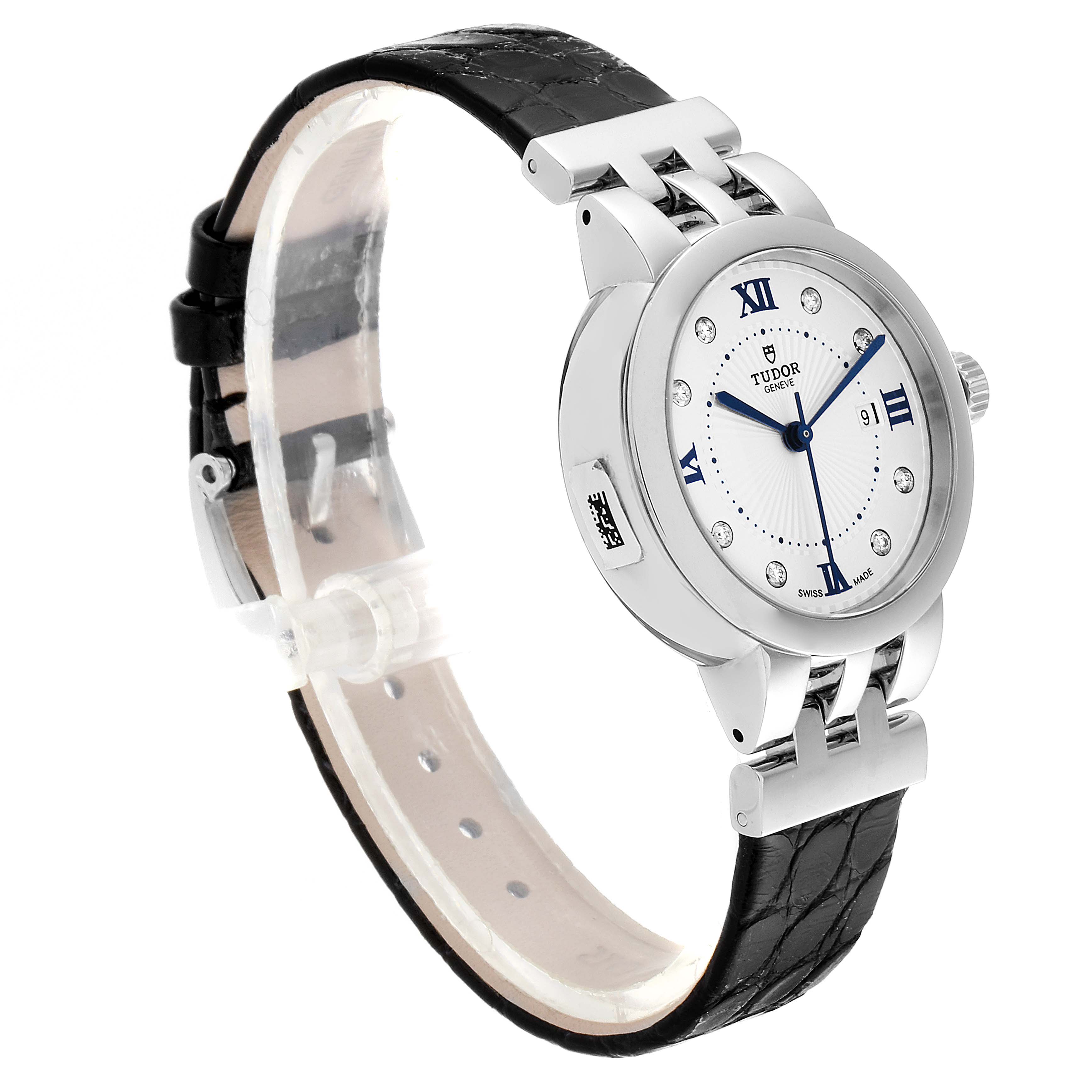 The image shows a Tudor Clair de Rose M35800-0006 Women
s Stainless Steel Silver Dial M35800-0006 Women
s Stainless Steel Silver Dial watch at a three-quarter angle, highlighting the face, bezel, and black leather strap.