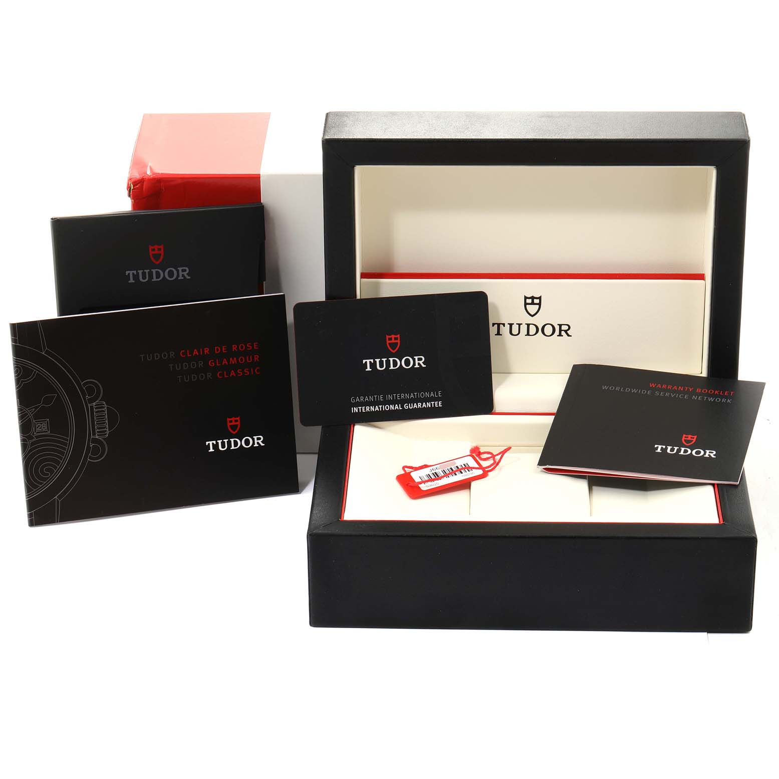 The image shows the packaging, manuals, warranty card, and a tag for a Tudor Glamour M53020-0074 Women's Stainless Steel White Dial M53020-0074 Women's Stainless Steel White Dial model watch.