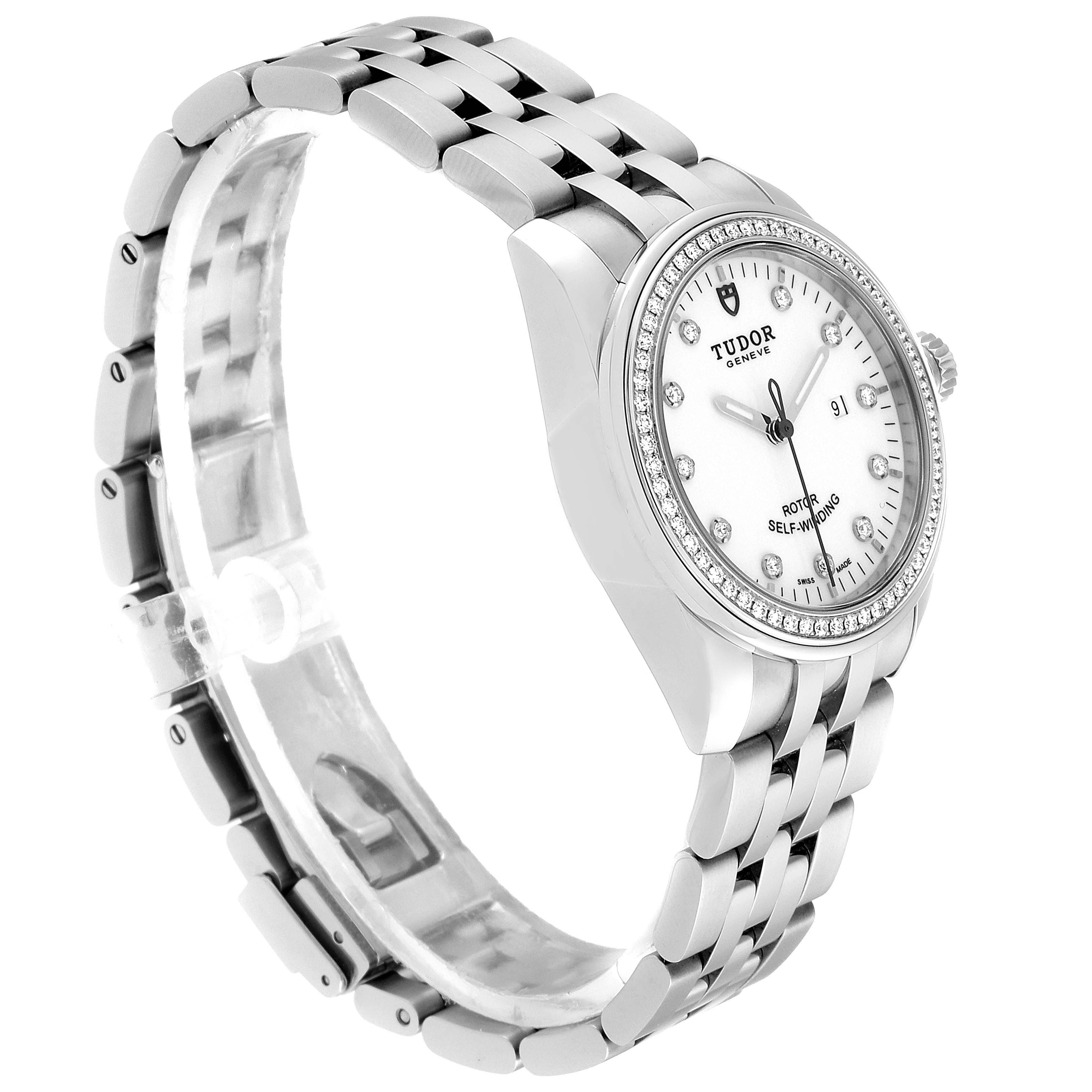 The Tudor Glamour M53020-0074 Women's Stainless Steel White Dial M53020-0074 Women's Stainless Steel White Dial watch is shown at an angle highlighting its dial, bezel, crown, and bracelet.