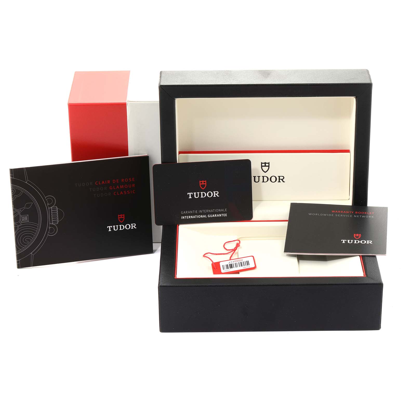 This image shows the packaging, warranty booklet, and international guarantee card for the Tudor Glamour 55003-0007 Men's Steel and Gold (two tone) Black Dial 55003-0007 Men's Steel and Gold (two tone) Black Dial model watch.