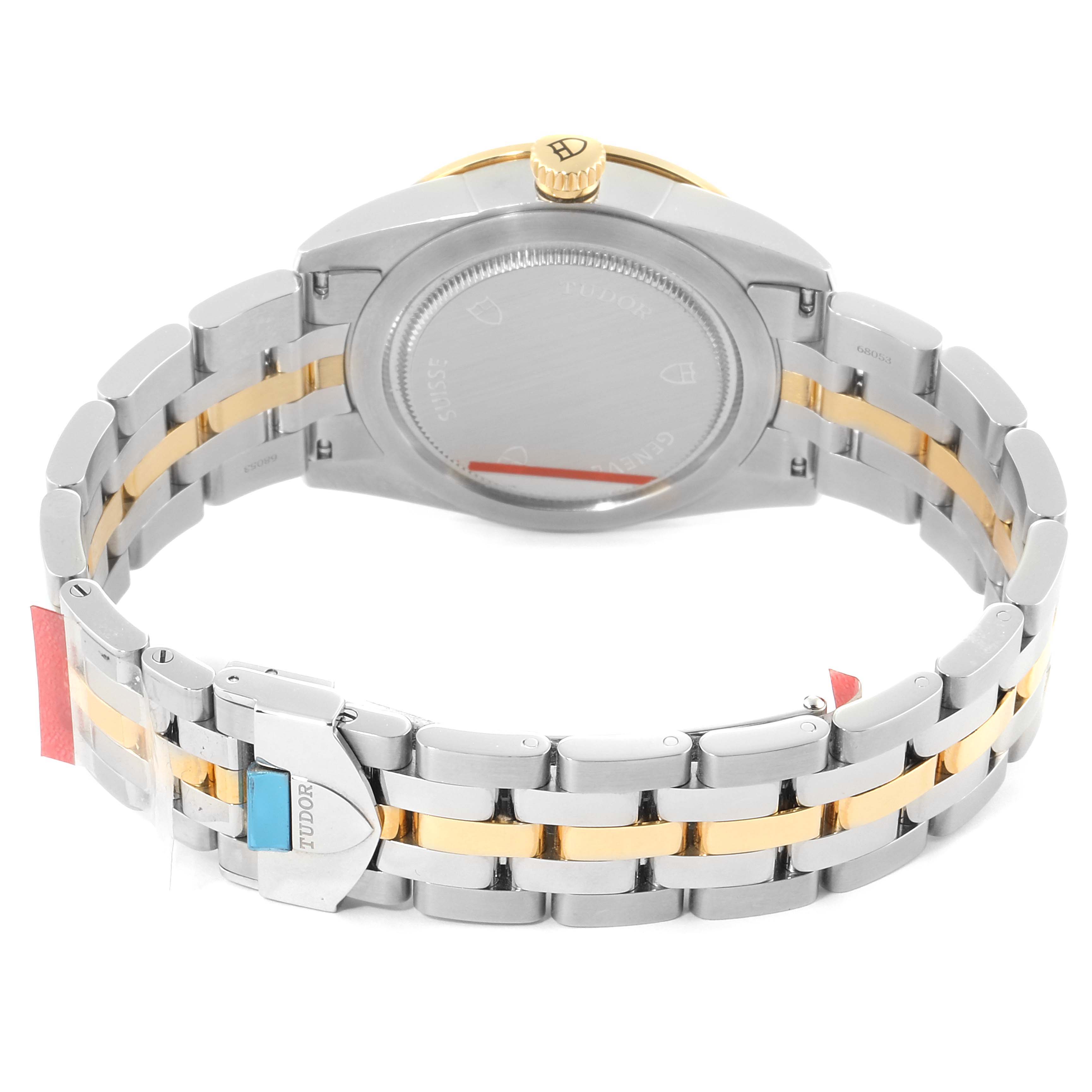 This image shows the back case, crown, and bracelet of the Tudor Glamour 55003-0007 Men's Steel and Gold (two tone) Black Dial 55003-0007 Men's Steel and Gold (two tone) Black Dial model watch.