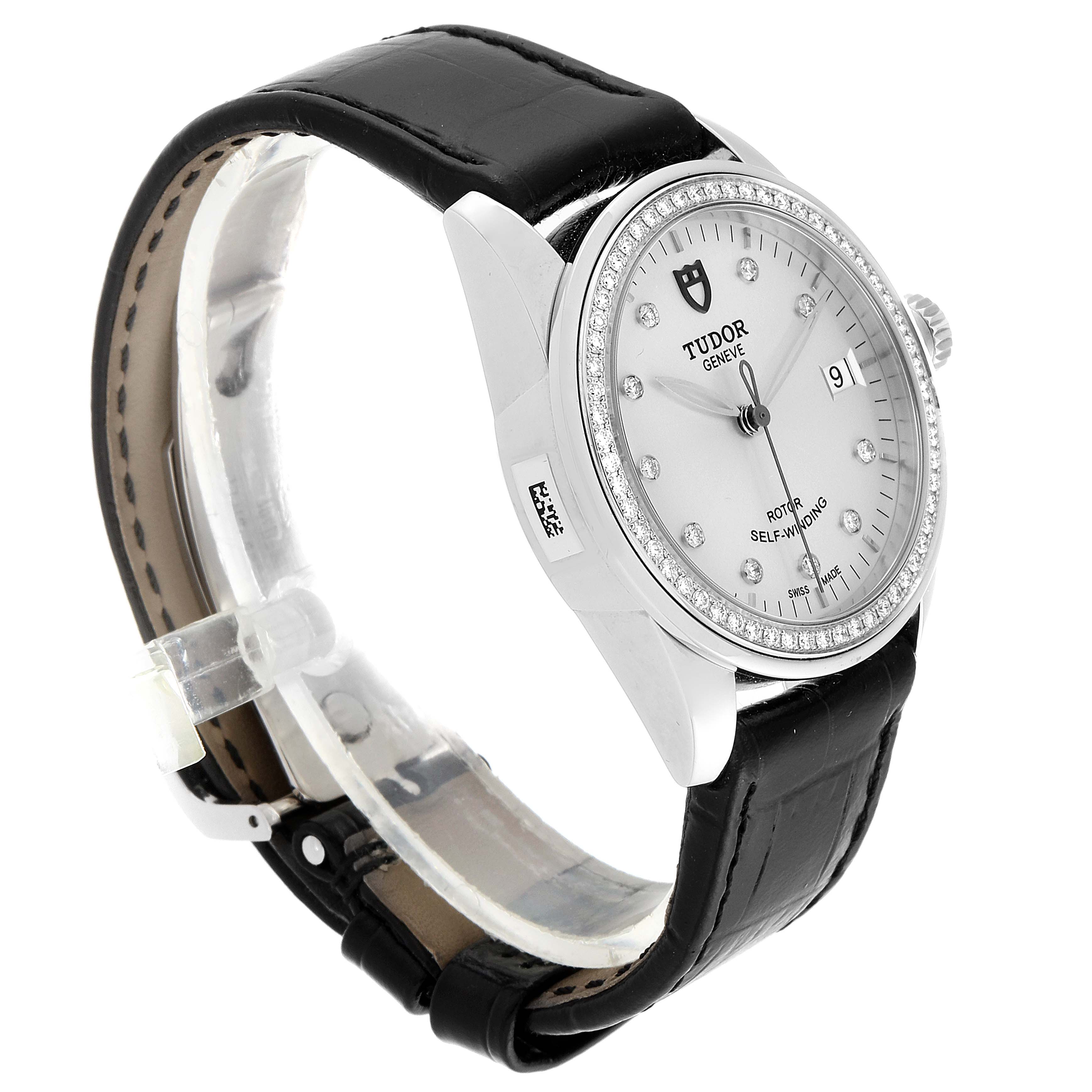 The image shows a side-angle view of a Tudor Glamour M55020-0057 Men's Stainless Steel Silver Dial M55020-0057 Men's Stainless Steel Silver Dial watch, displaying its dial, bezel, crown, and leather strap.