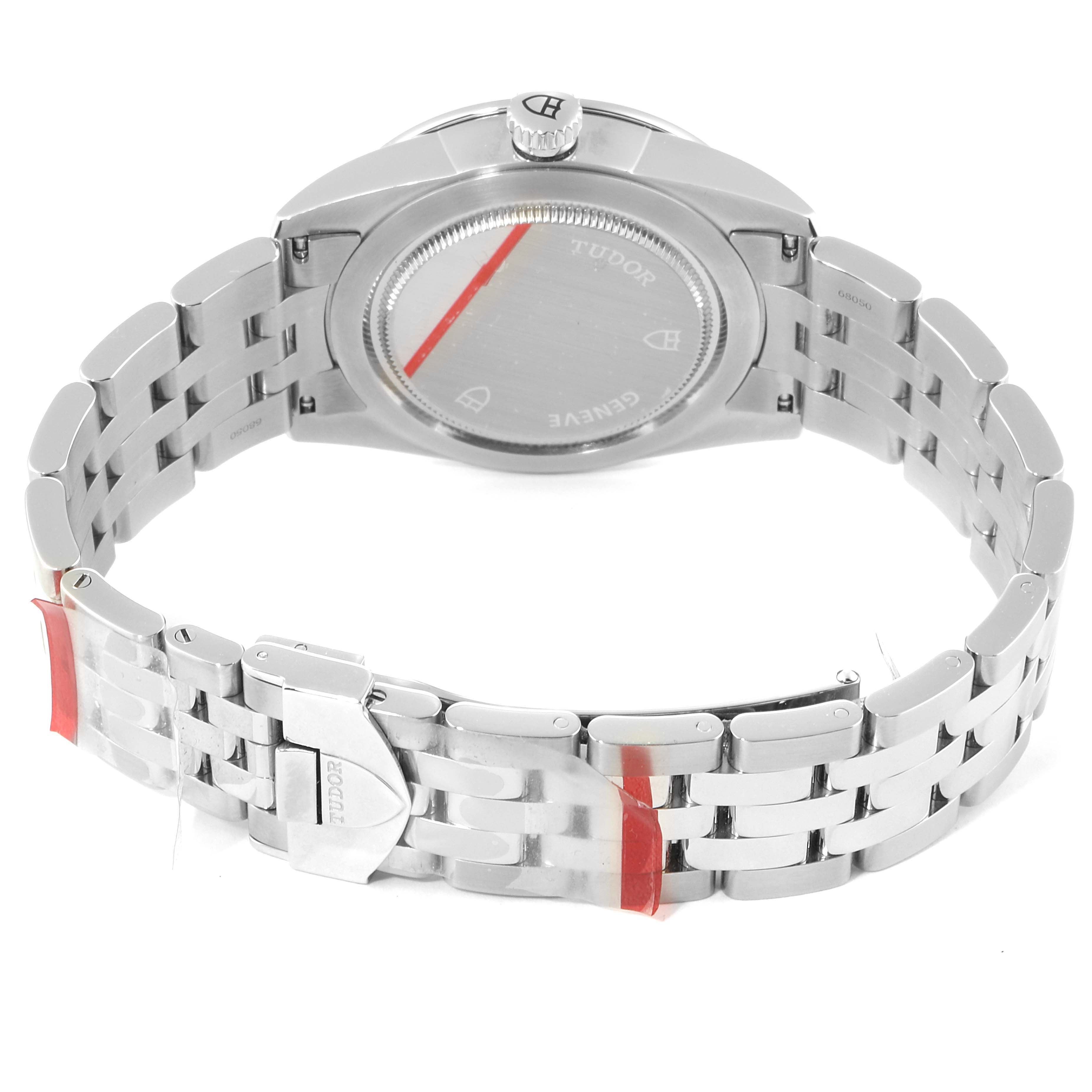 The image shows the back view and bracelet of the Tudor Glamour M55020-0003 Men
s Stainless Steel Silver Dial M55020-0003 Men
s Stainless Steel Silver Dial watch model.