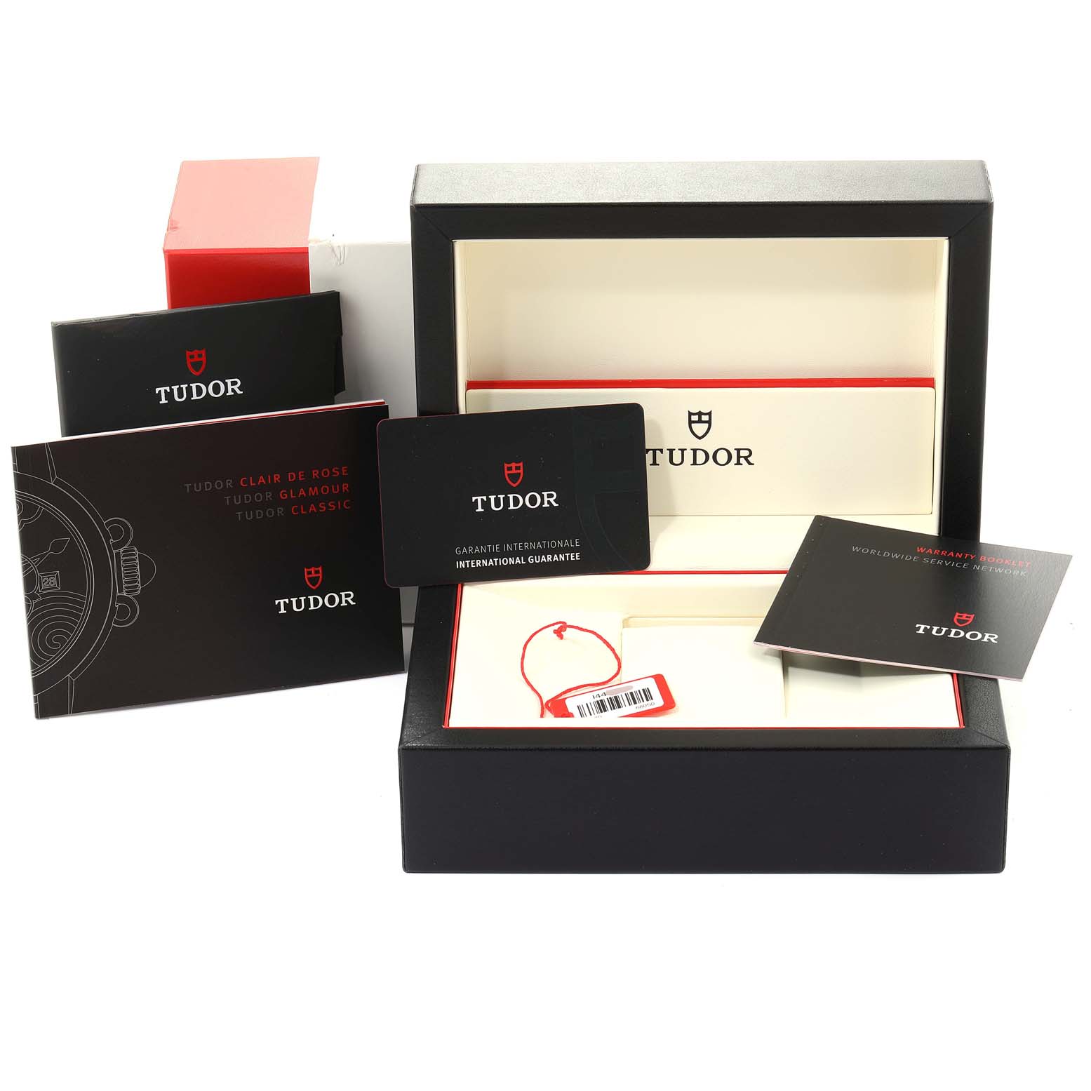 The image shows the packaging, warranty cards, manuals, and box of the Tudor Glamour M55020-0003 Men
s Stainless Steel Silver Dial M55020-0003 Men
s Stainless Steel Silver Dial watch model.