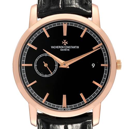 The Vacheron Constantin Traditionnelle watch is shown from a front angle, displaying its black dial, rose gold markers, and leather strap.