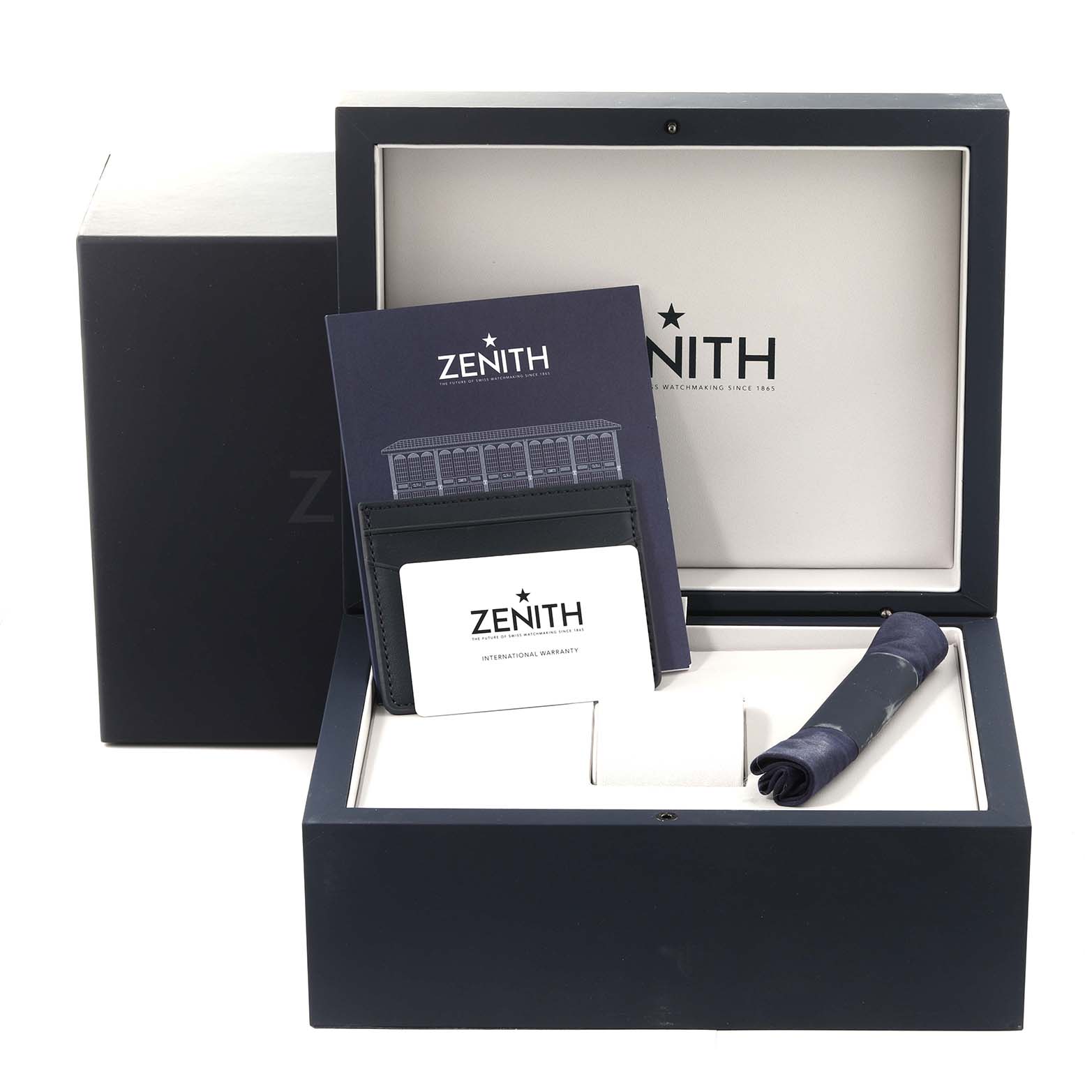The image shows the packaging, warranty card, and booklets for a Zenith Chronomaster 03.3100.3600/69.M3100 Men
s Stainless Steel White Dial 03.3100.3600/69.M3100 Men
s Stainless Steel White Dial watch inside an open box, viewed from the front.