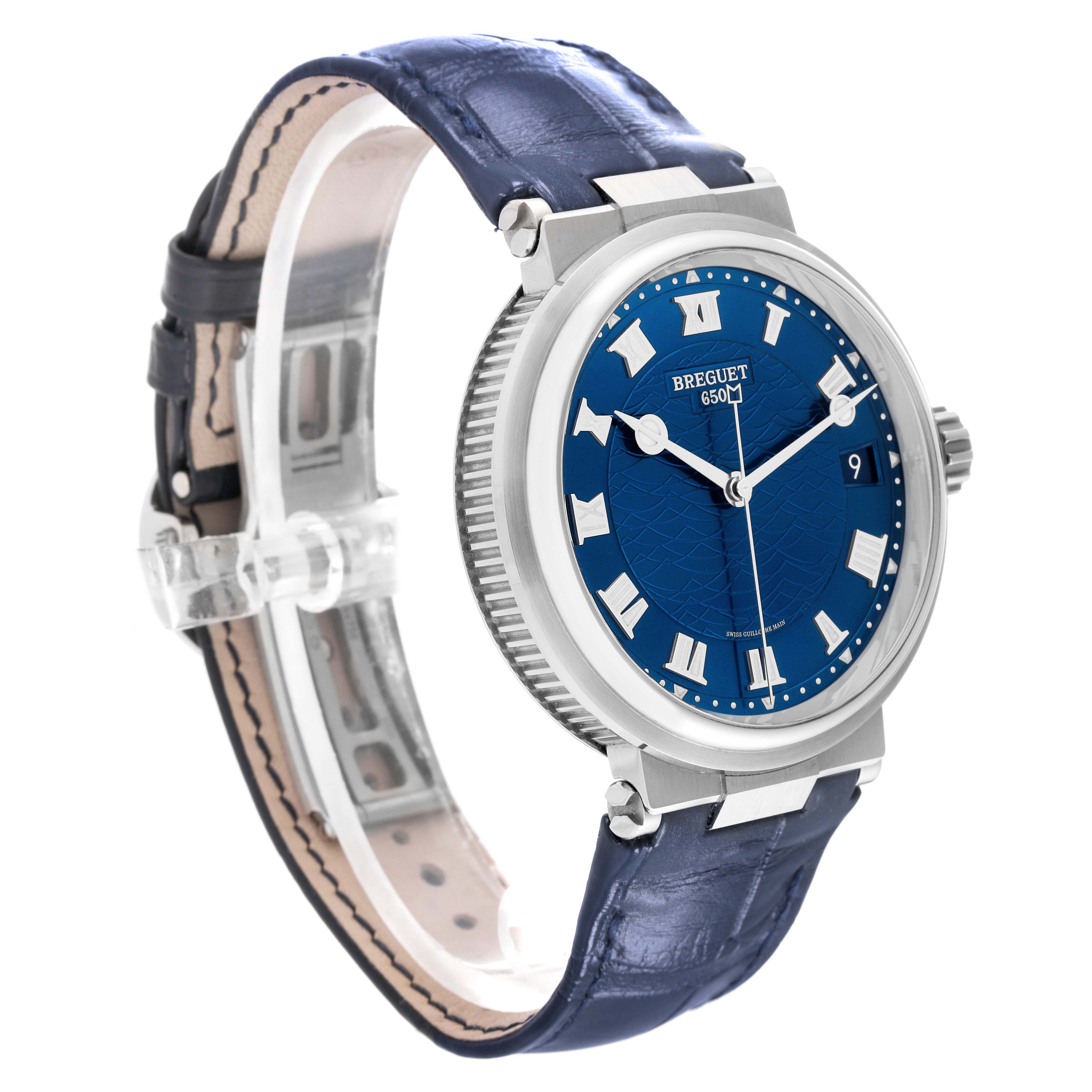 The image shows a Breguet Marine 5517BB/Y2/9ZU Men's White Gold Blue Dial 5517BB/Y2/9ZU Men's White Gold Blue Dial model watch from a side angle, highlighting its blue dial, leather strap, and crown.