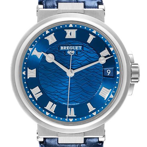 The image shows a frontal view of the Breguet Marine watch, highlighting its blue dial, Roman numerals, and date window at 3 o'clock.