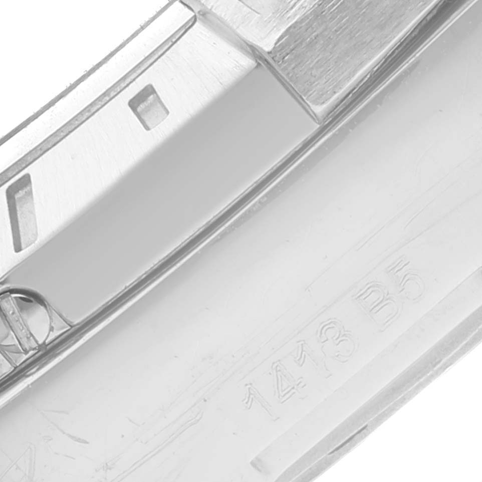 This image shows a close-up of the bezel and part of the bracelet of a Breitling Avenger A32390 Men's Stainless Steel Black Dial A32390 Men's Stainless Steel Black Dial watch, highlighting its stainless steel detail and marking.