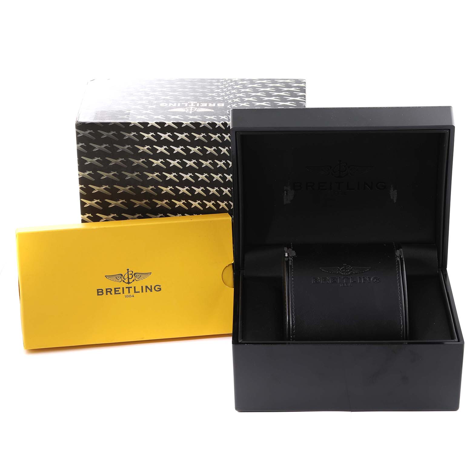 The image shows the packaging and inner box of the Bentley model by Breitling, including a yellow outer box.