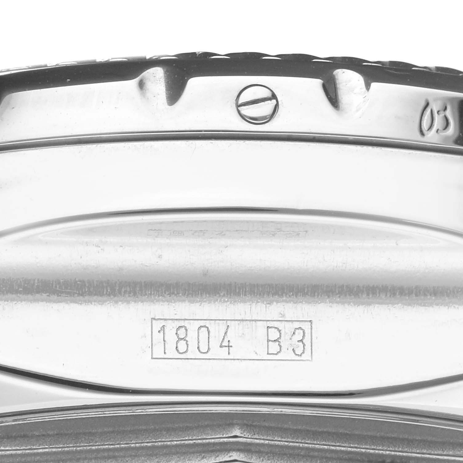 This close-up image shows the side of the Breitling Bentley A25362 Men's Stainless Steel Blue Dial A25362 Men's Stainless Steel Blue Dial watch, including part of the bezel, a screw, and a serial number.
