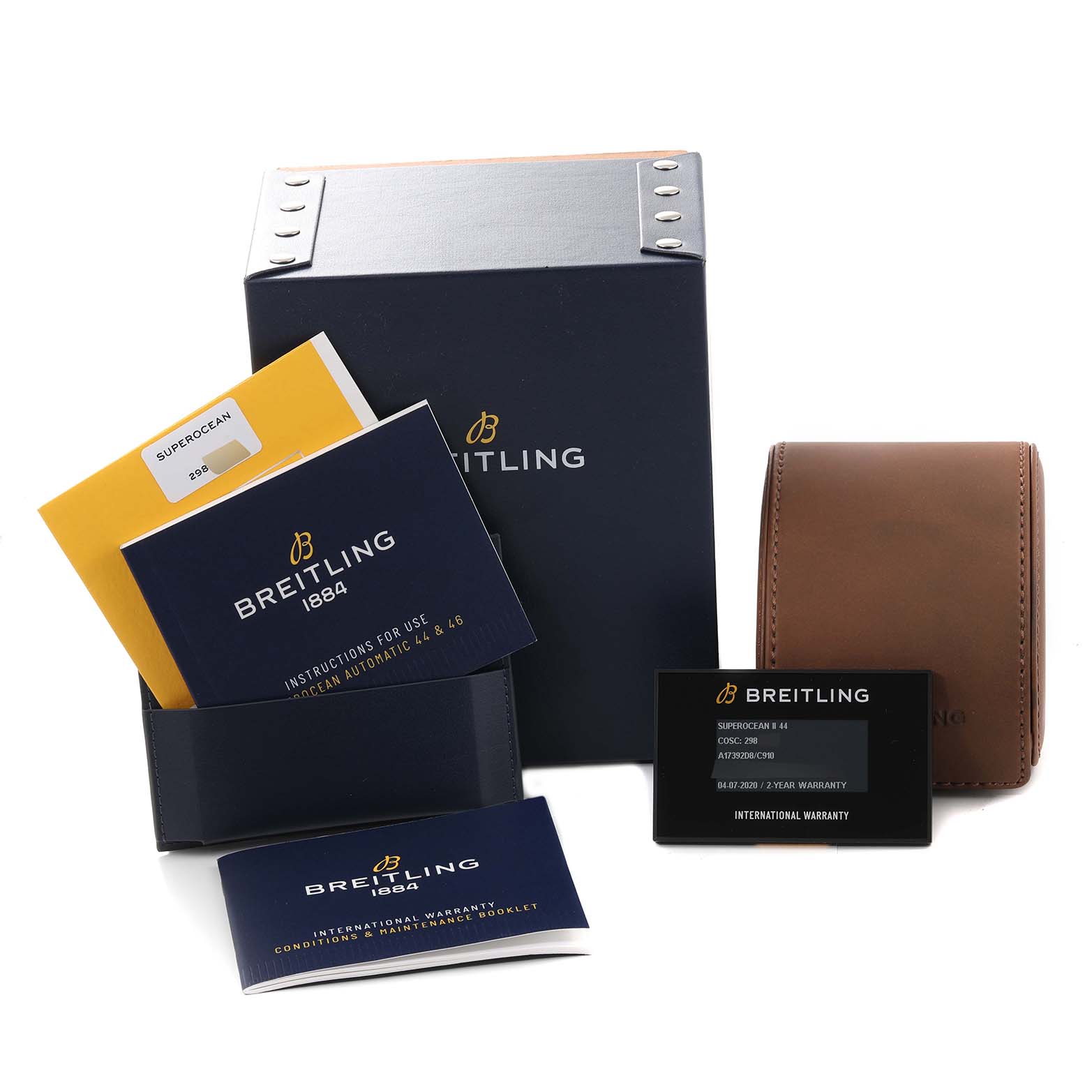The image shows the packaging and accessories for a Breitling Superocean A17392D8/C910 Men's Stainless Steel Blue Dial A17392D8/C910 Men's Stainless Steel Blue Dial watch, including boxes, manuals, a card, and a travel case.