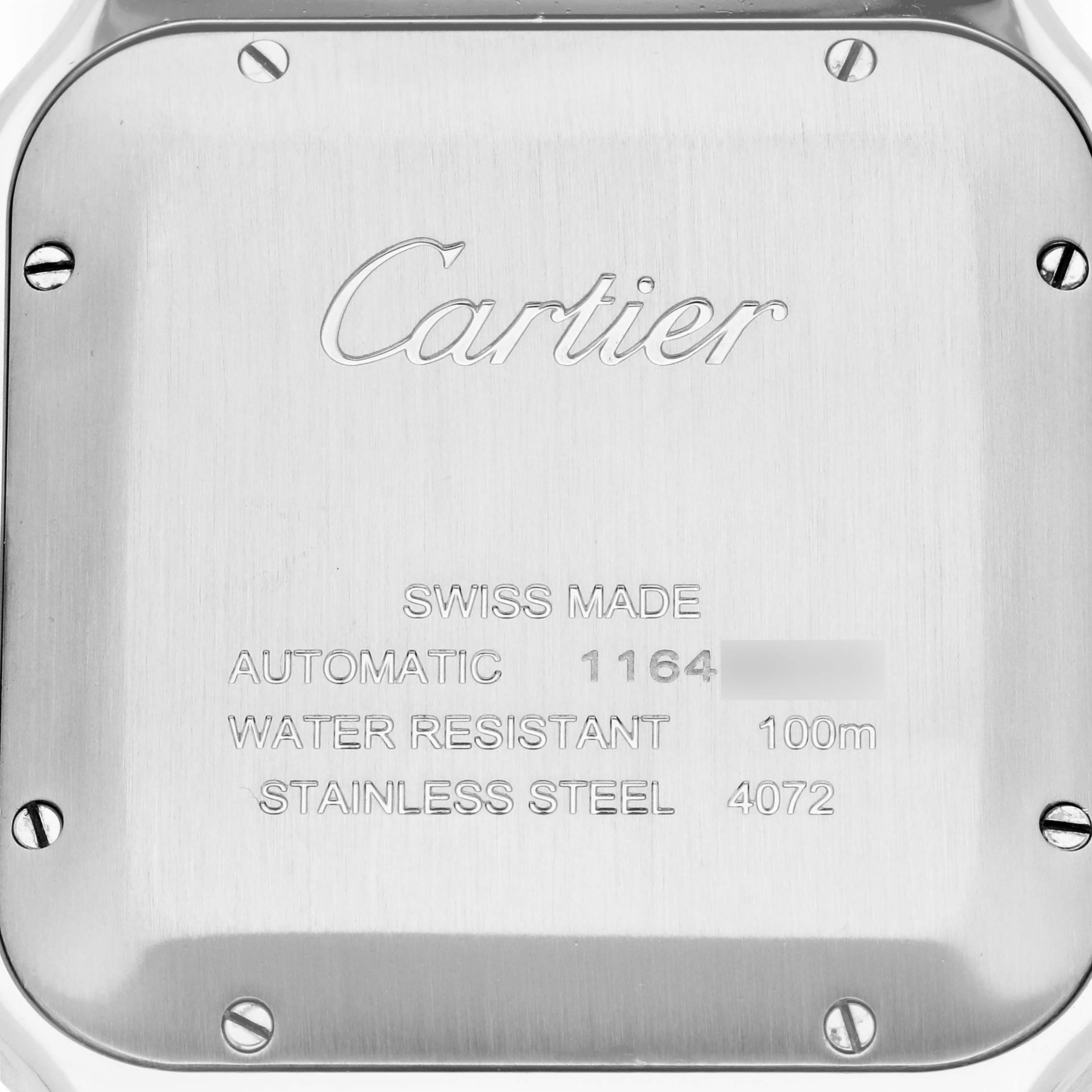 The image shows the back case of a Cartier Santos W2SA0009 Men
s Stainless Steel Silver Dial watch, highlighting its engraved details and screws.