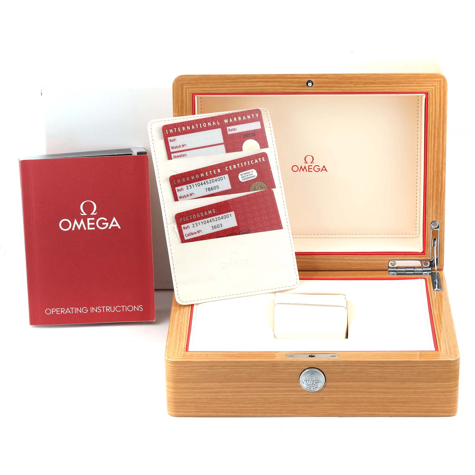 The image shows the packaging and documentation for an Omega Seamaster 231.10.44.52.04.001 Men's Stainless Steel White Dial 231.10.44.52.04.001 Men's Stainless Steel White Dial watch, including the box, warranty cards, and manual.